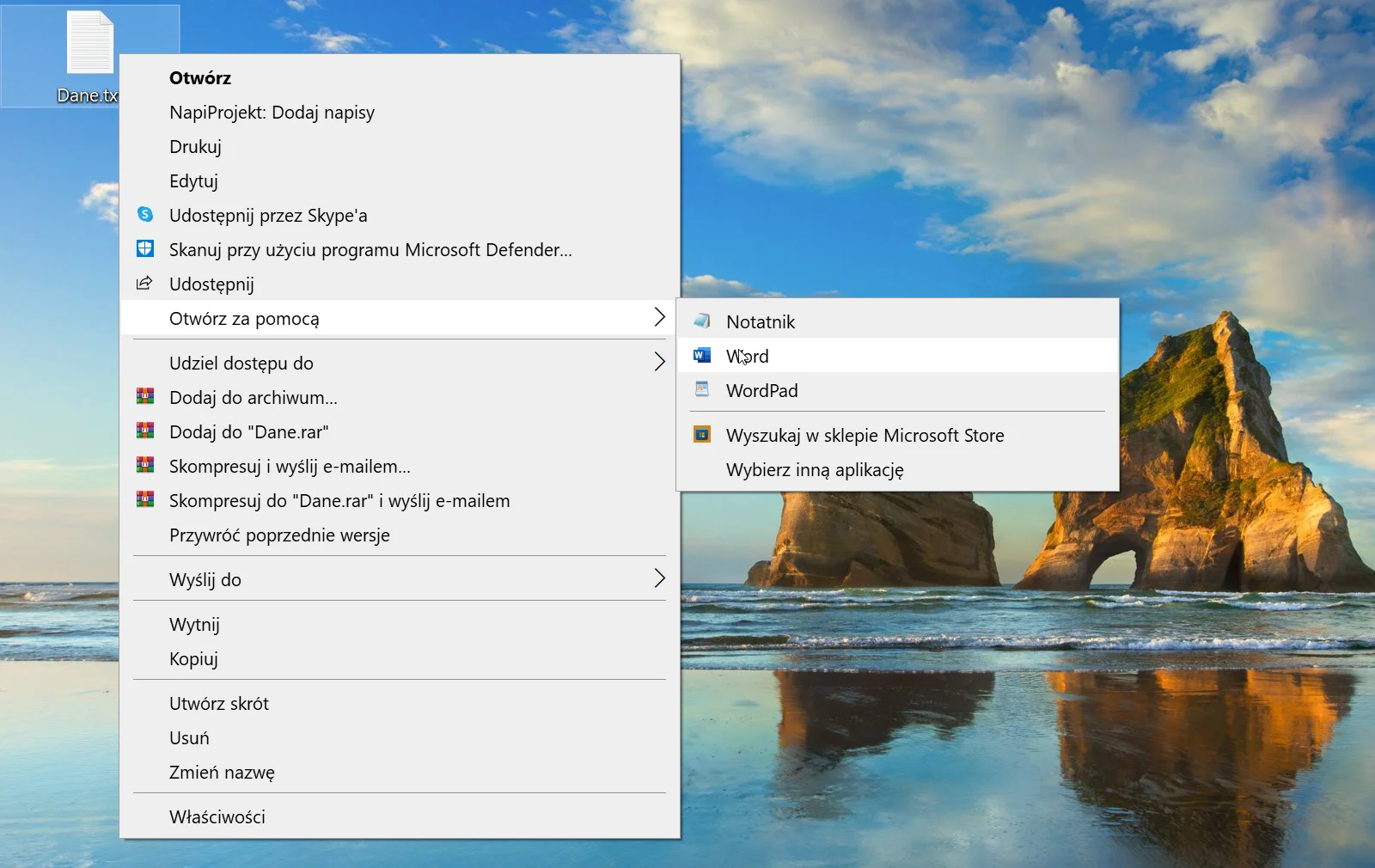 Zrzut okna menu kontekstowego w systemie Windows. Menu kontekstowe jest otwarte dla pliku "Dane.txt". Dostępne opcje to "Otwórz", "NapiProjekt: Dodaj Napisy", "Drukuj", "Edytuj", "Udostępnij przez Skype'a", "Skanuj przy użyciu programu Microsoft Defender", "Udostępnij", "Otwórz za pomocą", "Udziel dostępu do", "Dodaj do archiwum", "Dodaj do "Dane.rar", "Skompresuj i wyślij e‑mailem..", "Skompresuj do "Dane.rar" i wyślij e‑mailem", "Przywróć poprzednie wersje", "Wyślij do...", "Wytnij", "Kopiuj", "Utwórz skrót", "Usuń", "Zmień nazwę", "Właściwości". Wybrana jest opcja "Otwórz za pomocą" w której w dodatkowym menu pojawiają się możliwości "Notatnik", "WordPad", "Word", "Wyszukaj w sklepie Microsoft Store", "Wybierz inną aplikację".  
