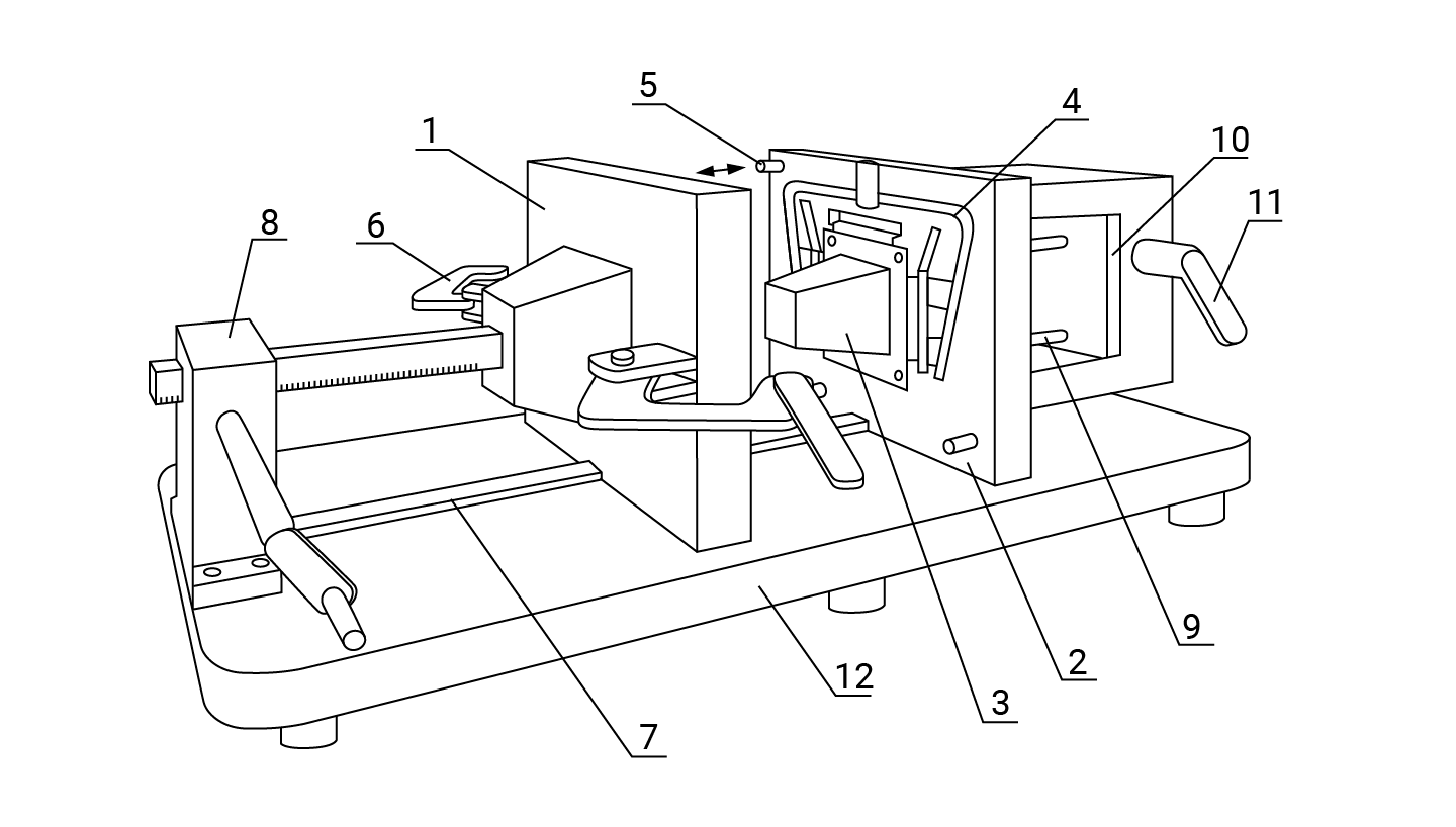 Na zdjęciu widoczny jest czarno biały schemat kokilarki ręcznej z zamontowana kokilą do wykonywania niewielkich odlewów. Podstawą urządzenia jest płyta osadzona na cylindrycznych nóżkach. Jest to stół oznaczony liczbą dwanaście. Na stole w środkowej części urządzenia znajduje się ruchoma połówka kokilki w kształcie płyty prostopadłościennej opisanej cyfrą jeden. Po lewej stronie , na końcu płyty znajduje się mechanizm zębatkowy. Mechanizm jest w kształcie prostopadłościanu z zamontowaną korbką po prawej stronie. Mechanizm jest pisany cyfrą osiem. Między mechanizmem a ruchomą połówką kokilki, na płycie znajduje się prowadnica. Prowadnica jest opisana cyfrą siedem. W połowie wysokości ruchomej połówki kokilki znajduje się zamknięcie oznaczone cyfrą sześć. Zamknięcie jest w kształcie dwóch zasuw. Każda z zasuw znajduje się po jednej ze stron. Po prawej stronie ruchomej połówki kokilki znajduje się stała połówka kokilki. Stała połówka jest oznaczona cyfrą dwa. Ma ona kształt prostopadłościennej płyty. W centralnej jej części znajduje się rdzeń. Rdzeń oznaczony cyfrą trzy jest o kształcie ostrosłupa. Wokół niego znajduje się układ wlewowy oznaczony cyfrą cztery. Za stałą częścią kokilki znajduje się prostopadłościenna komora oznaczona liczbą dziesięć. Jest to płyta wypychaczy. Po prawej stronie płyty znajduje się dźwignia o kształcie literki L. Jest to dźwignia zębatkowa napędu płyty wypychaczy, liczba jedenaście. W środku płyty wypychaczy widać dwa pręty oznaczone cyfrą dziewięć. Są to Wypychacze.