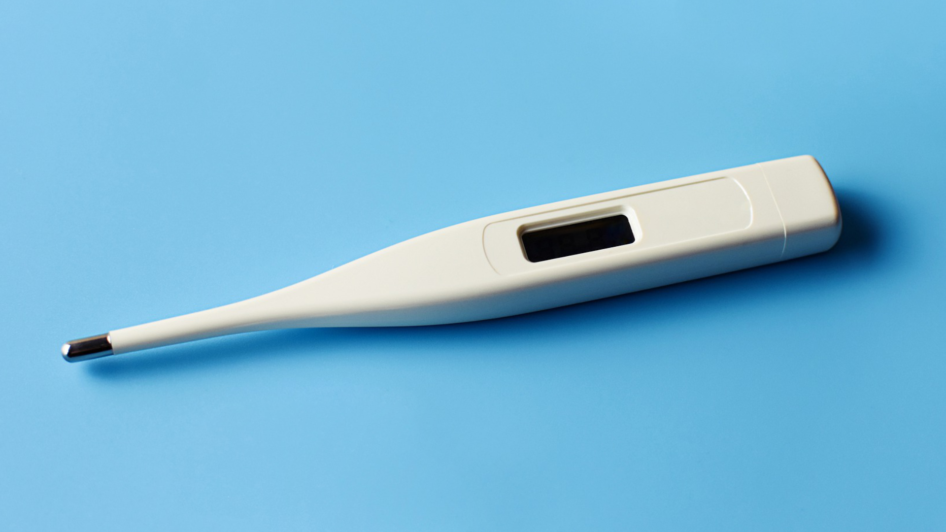 Zdjęcie przedstawia elektroniczny termometr.