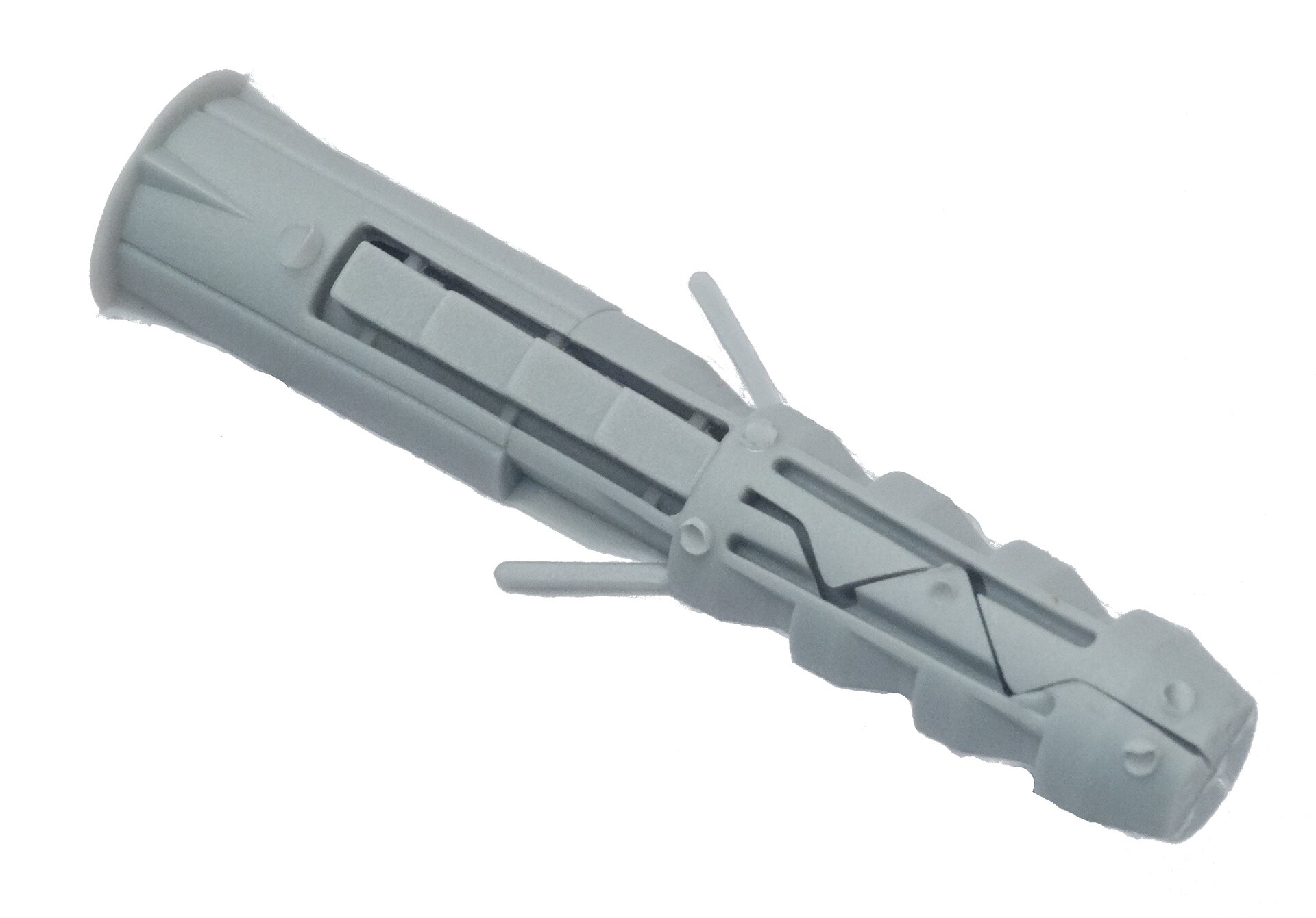 Zdjęcie przedstawia dybel, czyli element kołka rozporowego wykonany z tworzywa sztucznego. Dybel w strefie rozpierania posiada skrzydełka, które rozchylają się, przez co stabilizują jego położenie.