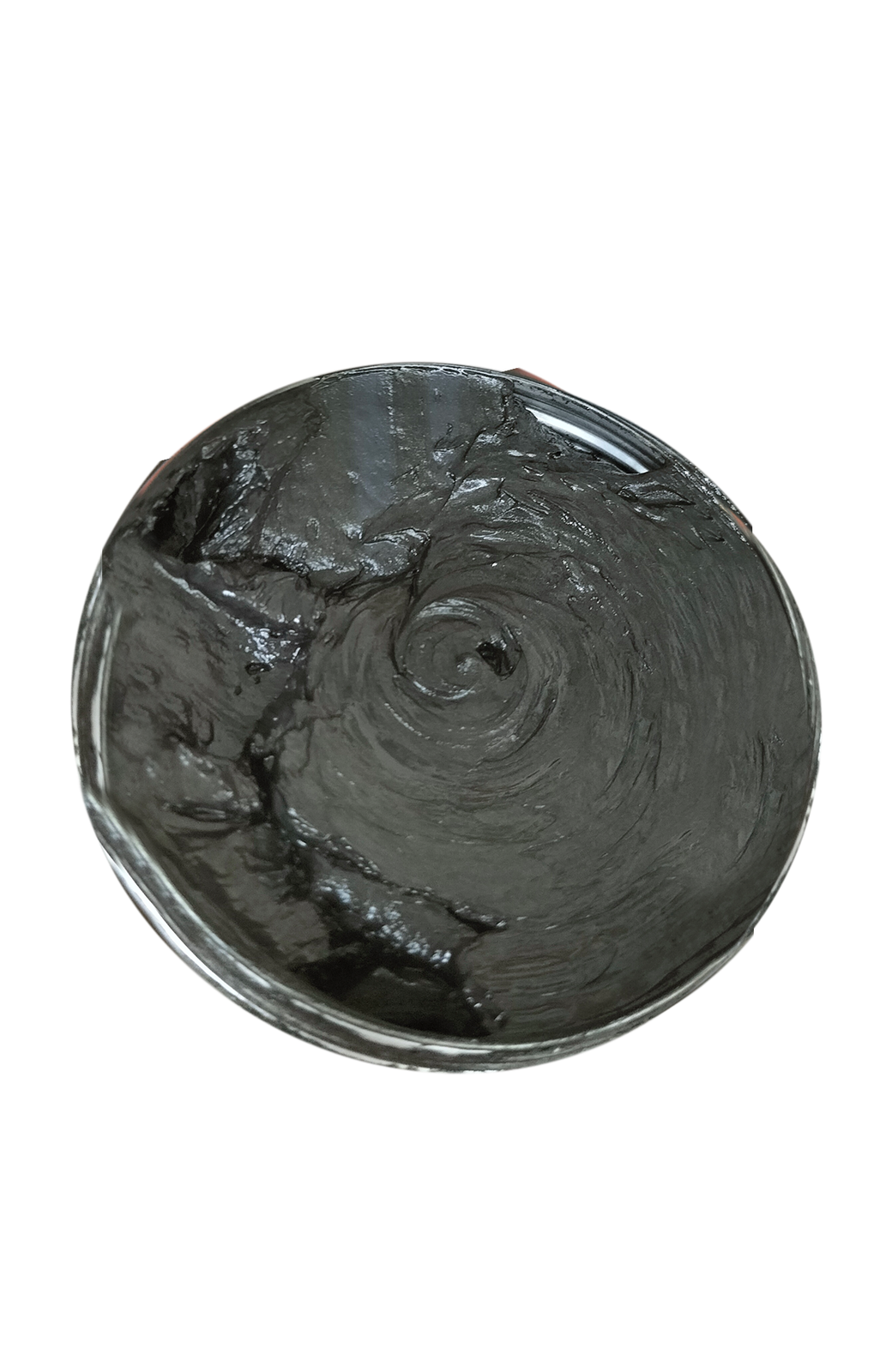 Zdjęcie przedstawia grafit stosowany do główek popychaczy, pilotów drewnianych, progów wiolinowych, mostków basowych. Widoczny jest okrągły metalowy pojemnik wypełniony czarną grafitową pastą.