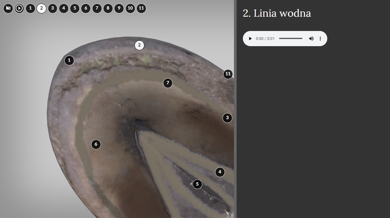 Przykładowy widok na wizualizację. Prawą część ekranu zajmuje czarna kolumna z białym napisem: 2.Linia wodna. Pod napisem znajduje się szary pasek z ikonami odtwarzania i głośności. P{ierwsza ikona ma kształt trójkąta skierowanego czubkiem w prawą stronę. Ikona głośności to mikrofon z dwiema liniami symbolizującymi rozchodzące się fale dźwiękowe. Między ikonami umieszczono czas nagrania – jedną sekundę oraz ciemnoszary krótki pasek. Po prawej stronie ekranu jest widoczny fragment grafiki. To kopyto widziane od dołu. Ma kształt dwóch brązowych półokręgów i trójkąta w środku. Na grafice znajduje się siedem cyfr w czarnych kółkach i jedna w białym. Ta ostatnia ma numer dwa. W lewym górnym rogu znajdują się także cyfry w czarnych kółkach.