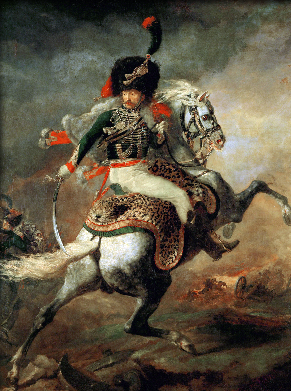 Ilustracja przedstawia obraz Théodore'a Géricaulta „Oficer szaserów". Dzieło przedstawia żołnierza jadącego na białym koniu. Na głowie ma dużą czarną czapkę, zieloną marynarkę, białe spodnie i buty sięgające łydki. Głowę ma obróconą do tyłu, ma poważną twarz, a w prawej ręce trzyma szable opuszczoną ku dołowi. Siedzi w siodle, pod którym jest skóra dzikiego kota. Koń zrywa się do jazdy i ma uniesione przednie kopyta w górze. Jest biały z nakrapianymi szarymi małymi plamkami i ma białą grzywę. W tle widać bitwę, kilku żołnierzy i armaty. Tło jest szare, ale w centralnej części widać blask słońca.