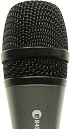 Zdjęcie przedstawia membranę mikrofonu w ujęciu frontalnym. Widoczna jest czarna cylindryczna membrana, wykonana z plecionki cienkich drucików, w dole i poniżej której biegną cieniukie czarne paski.