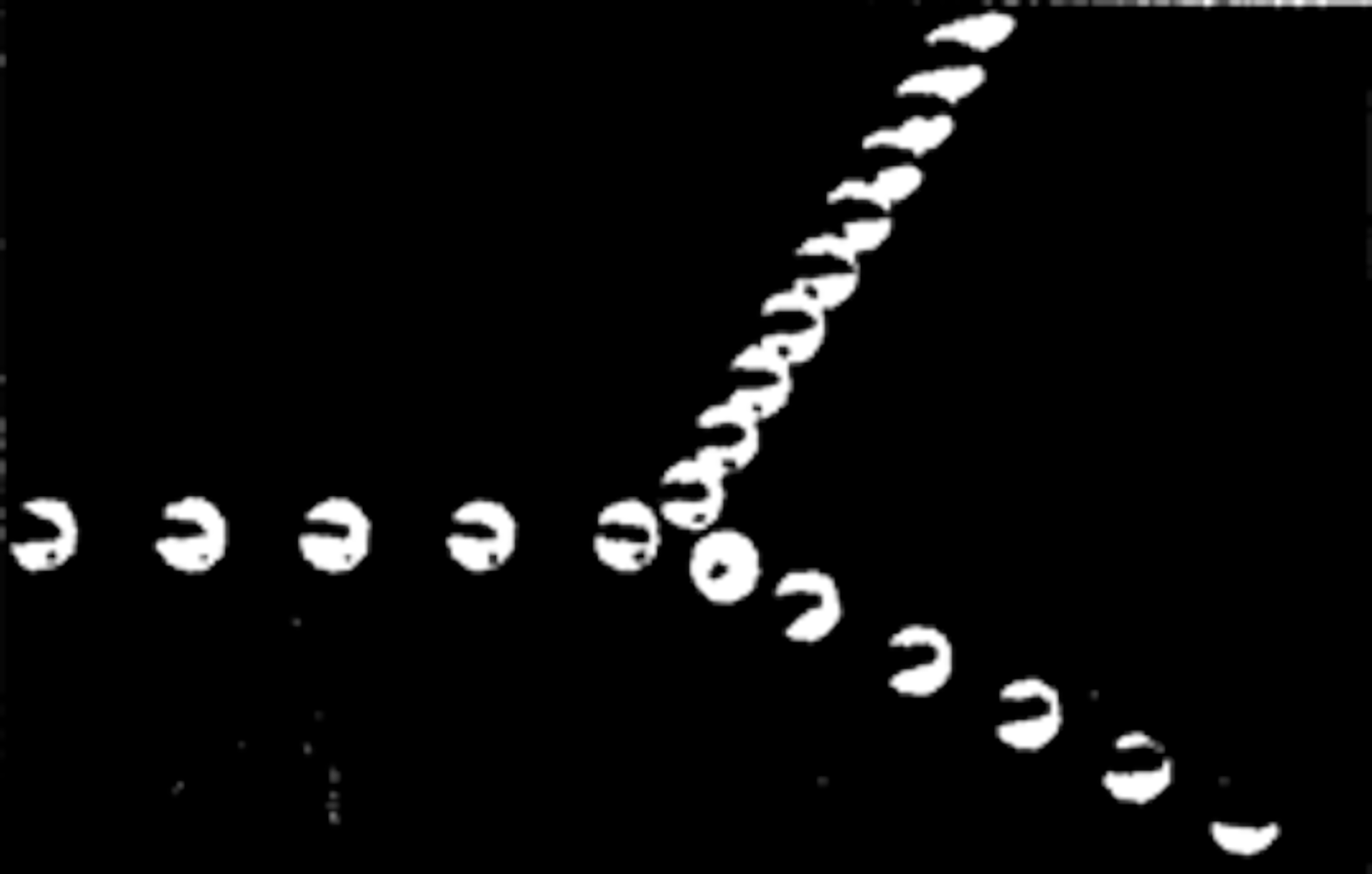 Rys. 3. Rysunek przedstawia zdjęcie stroboskopowe dwóch zderzających się ze sobą kul bilardowych. Na zdjęciu widać kolejne położenia kul. Ich trajektorie układają się w kształt litery Y, leżącej na boku.