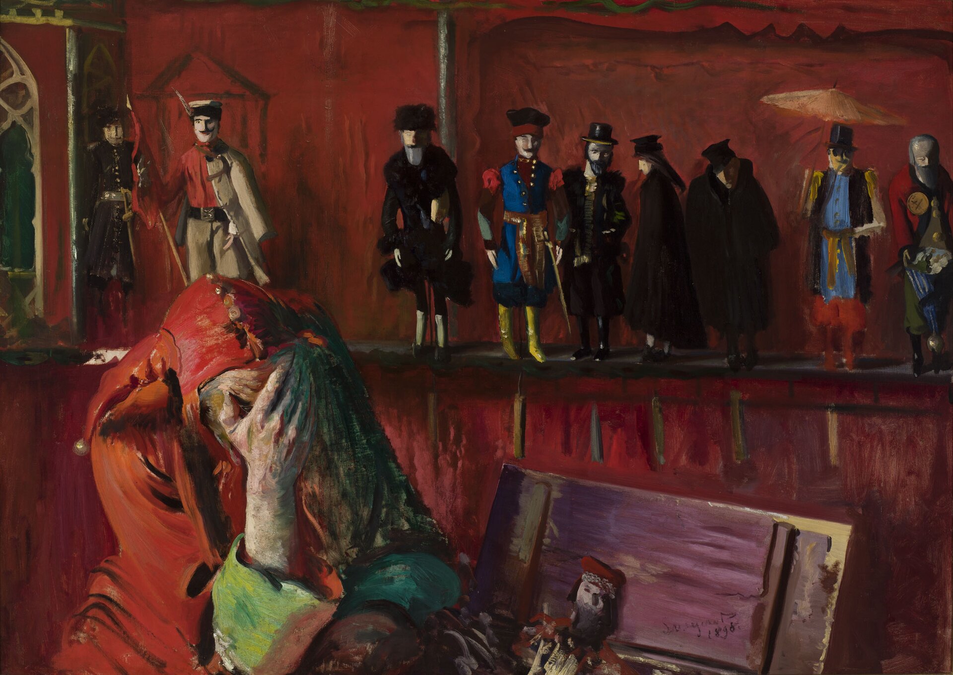 Ilustracja o kształcie poziomego prostokąta ukazuje obraz Leona Wyczółkowskiego „Stańczyk”. Przedstawia wnętrze  pomieszczenia, w którym po lewej stronie siedzi Stańczyk. Ubrany jest w błazeński strój w kolorze czerwonym. Siedzi zmartwiony, twarz zakrywa dłonią. Za nim znajduje się półka, na której ustawione są figurki, reprezentujące postacie pochodzące z różnych grup społecznych. 