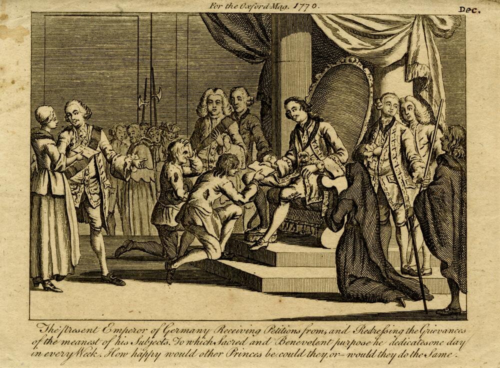Rycina przedstawia cesarza Józefa II siedzącego na tronie, otoczonego dworzanami. Przed tronem klęczy dwóch mężczyzn. Są ubrani w podarte ubrania. Cesarz wręcza jednemu z mężczyzn złożoną kartkę papieru.