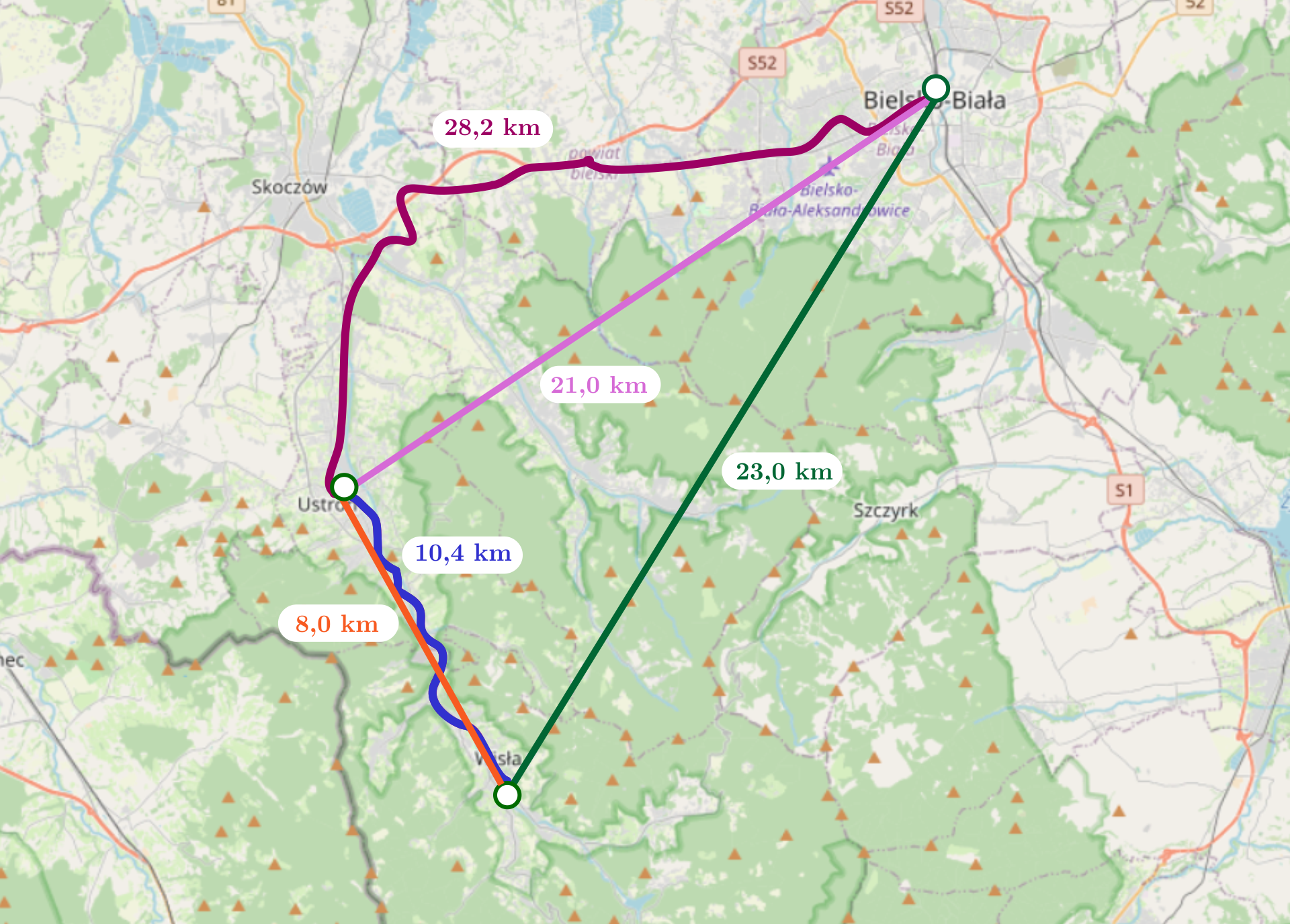 Rysunek przedstawia mapę na której zaznaczono miejscowości: Bielsko‑Biała, Ustroń, Wisła. Miejscowości te stanowią wierzchołki trójkąta prostokątnego, gdzie kąt prosty znajduje się przy Ustroniu. Bielsko‑Biała znajduje się na północy mapy, Ustroń na południowy‑zachód od Bielska‑Białej, a Wisła znajduje się na południowy wschód od Ustronia w jednej trzeciej odległości od Ustronia między Ustroniem a Bielskiem‑Białą na kierunku wschodnio‑zachodnim. Bordową krzywą połączono Bielsko‑Białą i Ustroń. Podpisano ją dwadzieścia osiem i dwie dziesiąte kilometra. Ustroń i Wisłę połączono niebieską krzywą, którą podpisano dziesięć i cztery dziesiąte kilometra. Bielsko‑Biała i Wisła zostały połączone odcinkiem podpisanym dwadzieścia trzy kilometry. Bielsko‑Biała i Ustroń zostały połączona odcinkiem podpisanym dwadzieścia jeden kilometrów. Ustroń i Wisła zostały połączone odcinkiem podpisanym osiem kilometrów.