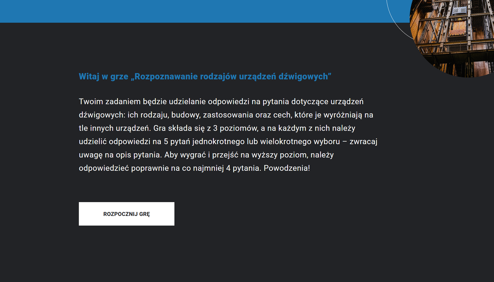Przykładowy widok okna gry edukacyjnej. Na zdjęciu widoczny jest czarny kwadrat, coś w rodzaju ekranu, na którym widoczny jest opis gry edukacyjnej wraz z poleceniem do niej. W prawym górnym rogu znajdują się zdjęcia urządzeń dźwigowych.