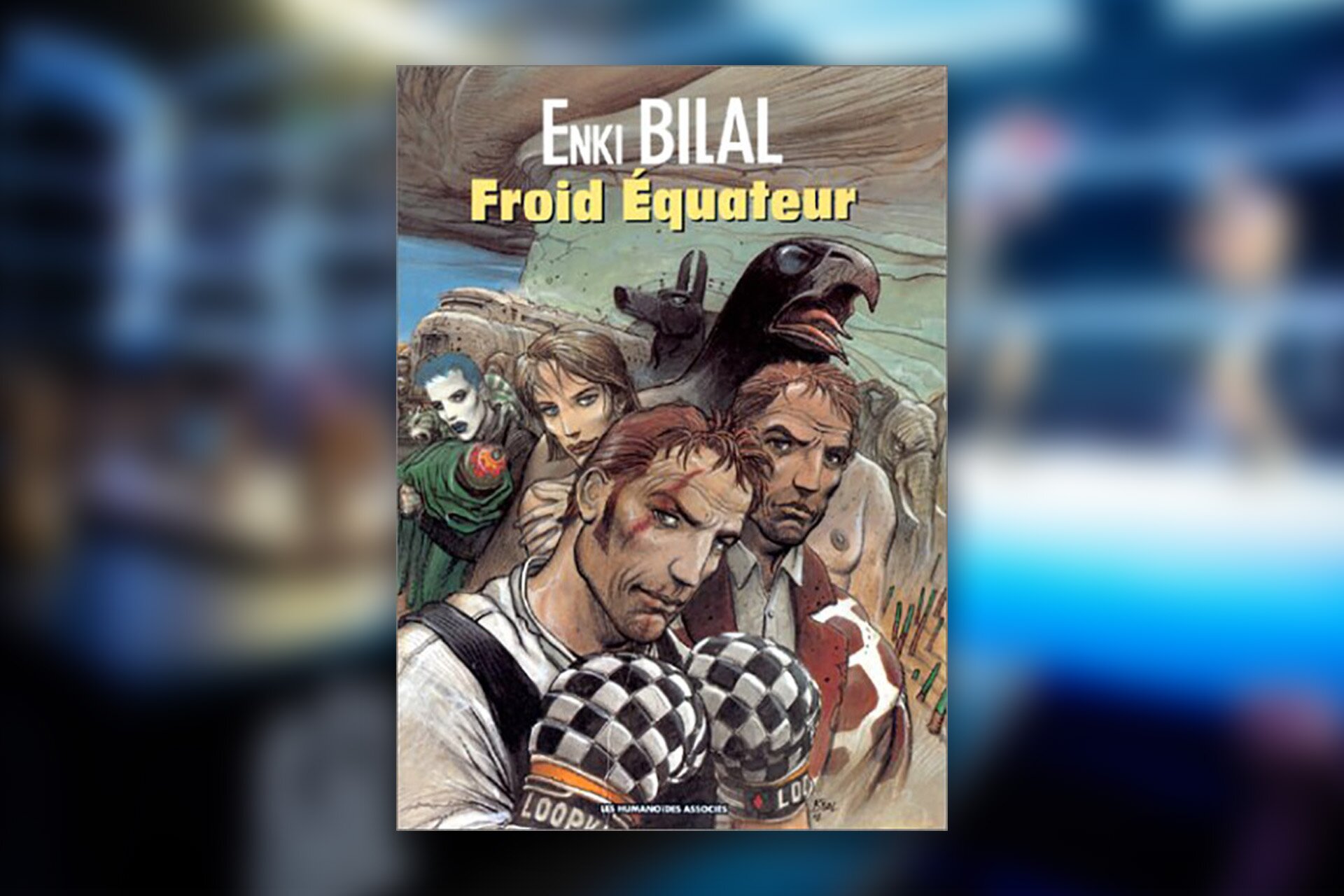 Ilustracja przedstawia okładkę książki, jest to komiks, gdzie widoczne są osoby, jedna z nich ma rękawice bokserskie. Za mężyzną widoczna jest kobieta, drugi mężczyzna oraz osoba z pomalowaną, białą twarzą. Za nimi widoczna jest głowa czarnego ptaka z ciałem człowieka oraz wilk. 