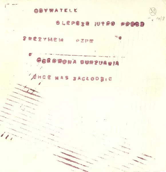 Zdjećie przedstawia kartkę papieru a na niej napisy: Obywatele o lepsze jutro. Precz z jarzmem PZPR. Czerwona burżuazja chce nas zagłodzić.