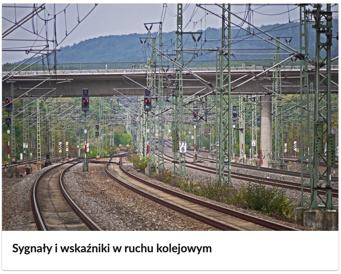Zdjęcie przedstawia okładkę atlasu interaktywnego, na której widoczne są tory kolejowe oraz świecące na czerwono sygnalizatory kolejowe. Poniżej tytuł e‑booka: Sygnały i wskaźniki w ruchu kolejowym.