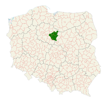 Kliknij aby powiększyć Grafika przedstawia mapę Polski, na której zaznaczono obszary województw (linie czarne) i powiatów (linie czerwone). Ziemia Dobrzyńska znajduje się w północnej części kraju, na terenie województwa kujawsko‑pomorskiego. Została ona zaznaczona zielonym kolorem.