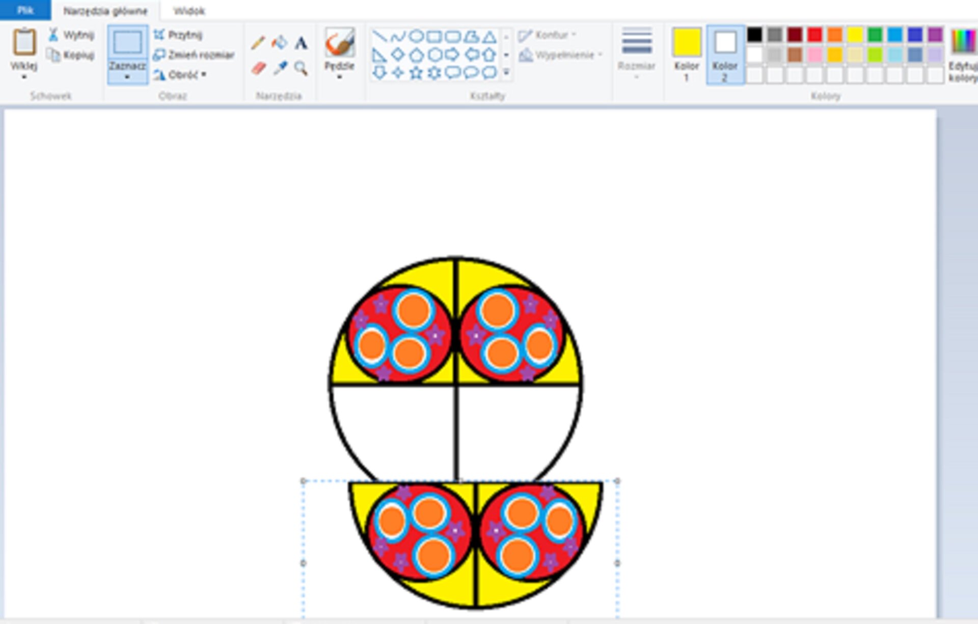 Zrzut okna programu Paint ilustrujący ostatni etap wykonania rozety, czyli skopiowanie dwóch elementów i użycie polecenia Przerzuć w pionie