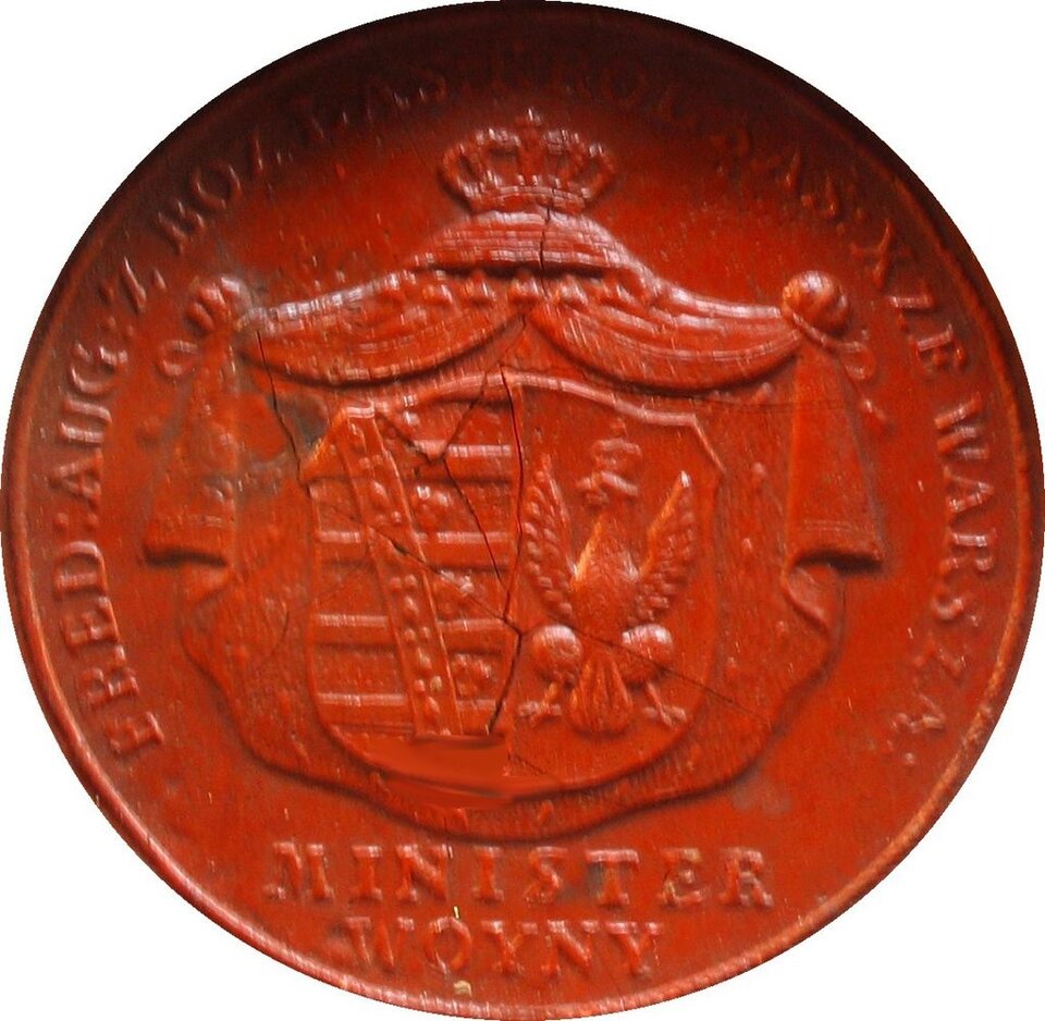 Zdjęcie przedstawia czerwoną pieczęć ministra wojny księcia Józefa Poniatowskiego, Na pieczęci widnieje herb Księstwa Warszawskiego.