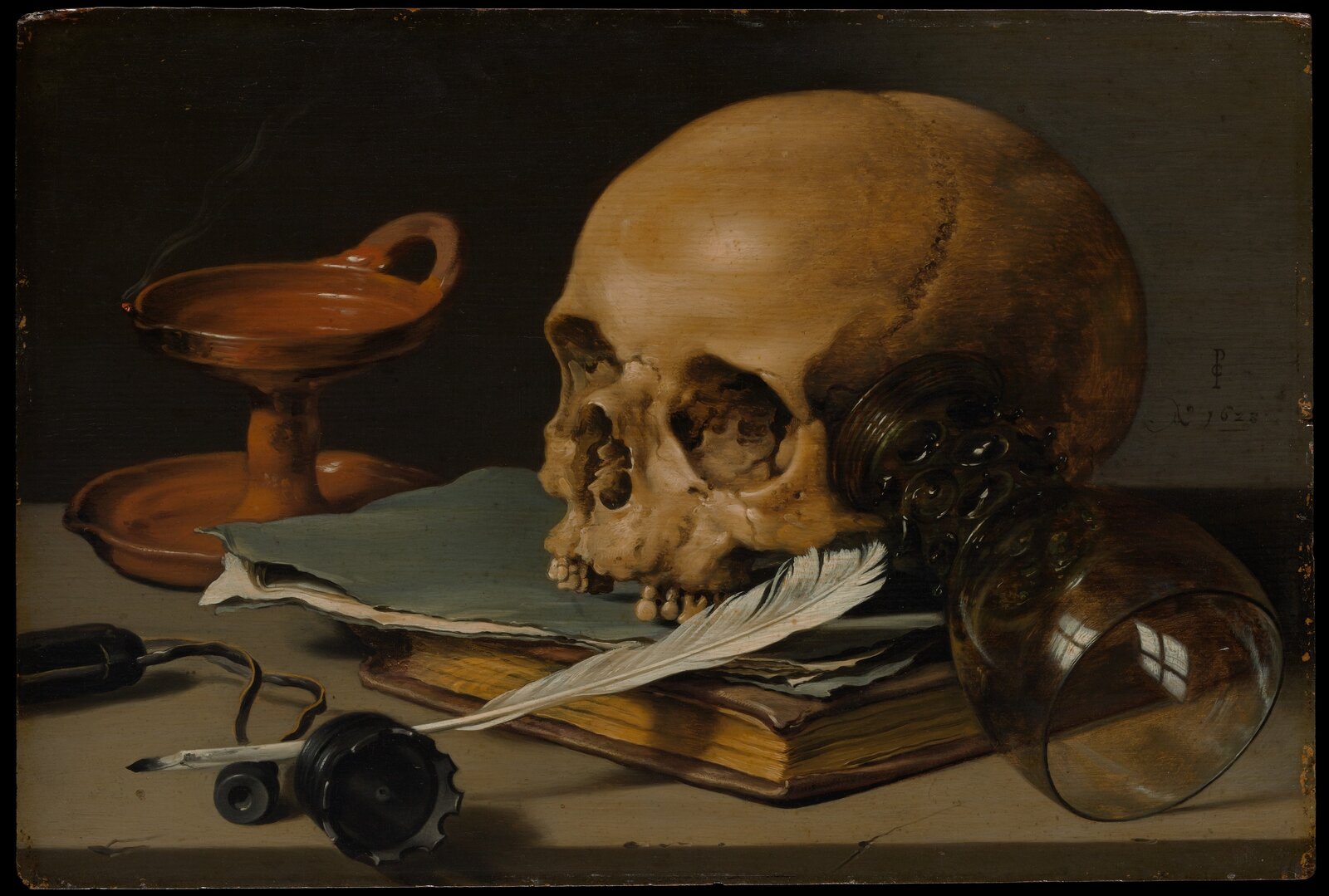 Martwa natura z czaszką i piórem Źródło: Piteter Claesz, Martwa natura z czaszką i piórem, 1628, olej na desce, Metropolitan Museum of Art, domena publiczna.