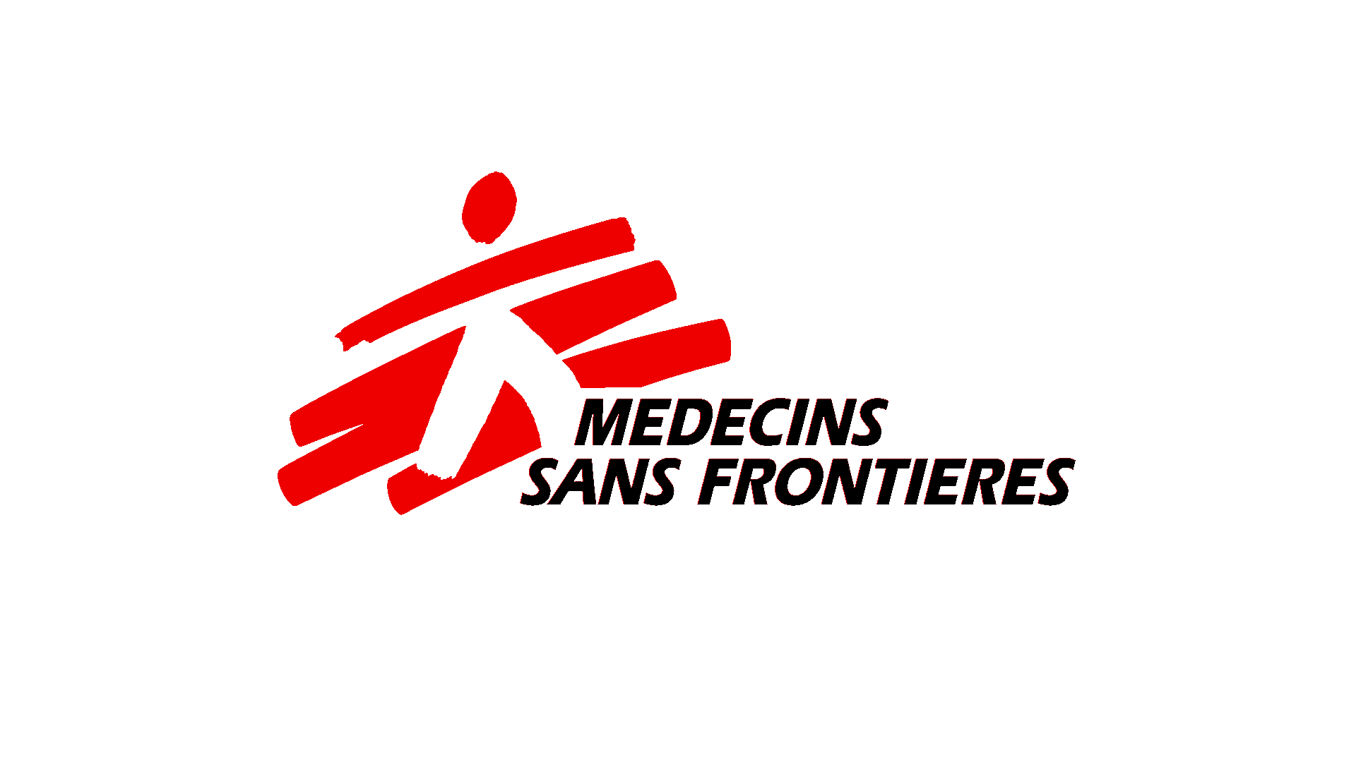 Zdjęcie przedstawia symbol organizacji pozarządowej Lekarze bez Granic. Składa się z czerwonych symboli. Czerwona kreska na górze oraz kropka nad liniami tworzą ręce i głowę ludzika, a biały znak na dwóch dolnych, czerwonych liniach w kształcie odwróconej litery V, nogi ludzika. Pod spodem z prawej strony znajduje się francuski napis Médecins Sans Frontières.