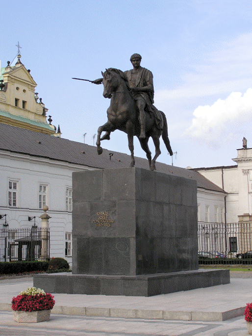 Zdjęcie przedstawia pomnik. Na dużym, wysokim postumencie znajduje się mężczyzna na koniu. Koń ukazany jest w ruchu, ma podniesioną przednią i tylną nogę. Mężczyzna ubrany jest w długi płaszcz, trzyma w prawej ręce miecz w geście gotowości do walki.