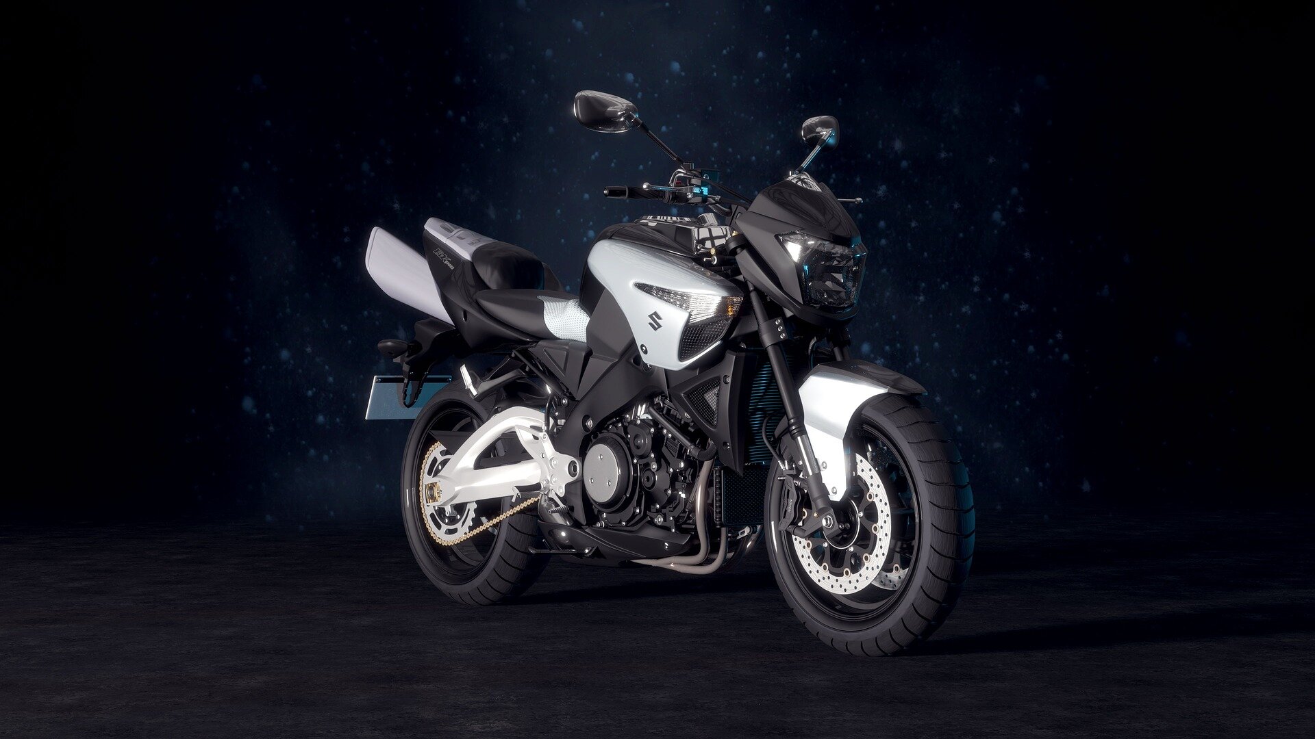 Zdjęcie przedstawia srebrno‑czarny motocykl. Jest elegancki, ukazany na granatowym tle z kroplami wody. 