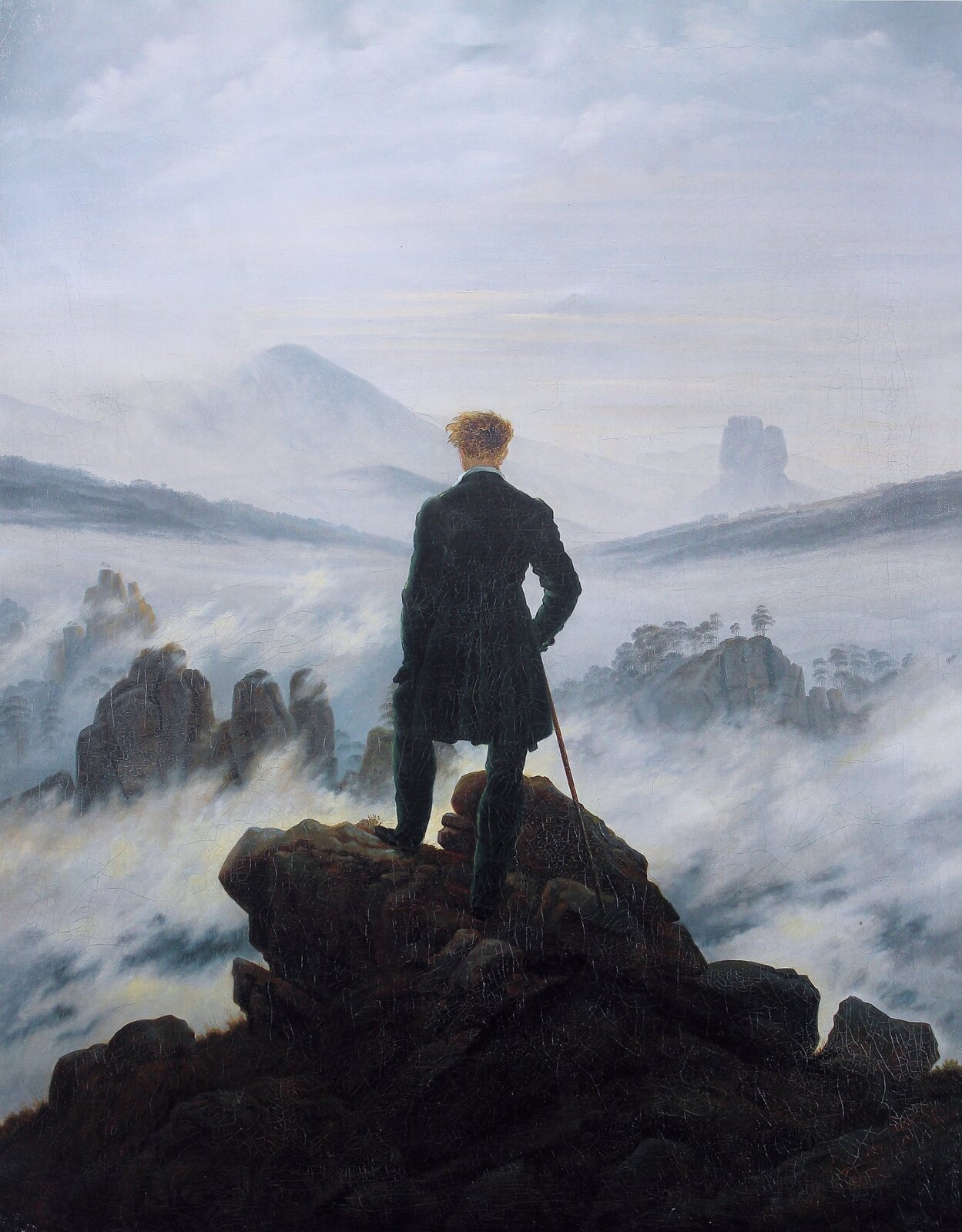 Ilustracja o kształcie pionowego prostokąta przedstawia obraz Caspara Davida Friedricha „Wędrowiec ponad morzem mgły”. Ukazuje stojącego na skale mężczyznę z laską w prawym ręku, zwróconego tyłem do widza i wpatrującego się w daleki pejzaż. W tle widoczne są fragmenty szczytów gór, skąpane we mgle. Im dalej, tym pejzaż staje się bardziej rozmyty i łączy się z jasnym niebem. 