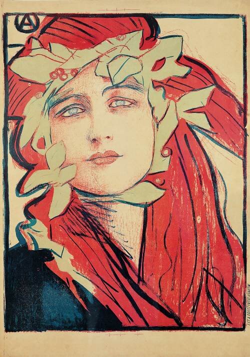 Na ilustracji znajduje się plakat przedstawiający popiersie kobiety z długimi czerwonymi włosami. Twarz okalają zielone liście z czerwonymi owocami.  Ma czarne ubranie. Twarz z makijażem zwraca w stronę widza. Postać otacza czarna ramka. Kobieta jest umieszczona na jasnym tle.