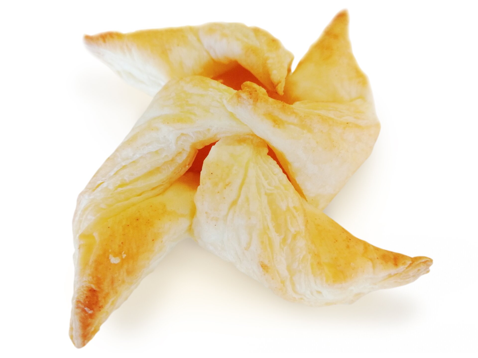 Ciastko koloru jasnozłotego, zwinięte w taki sposób, iż jego części są przeplecione ze sobą.