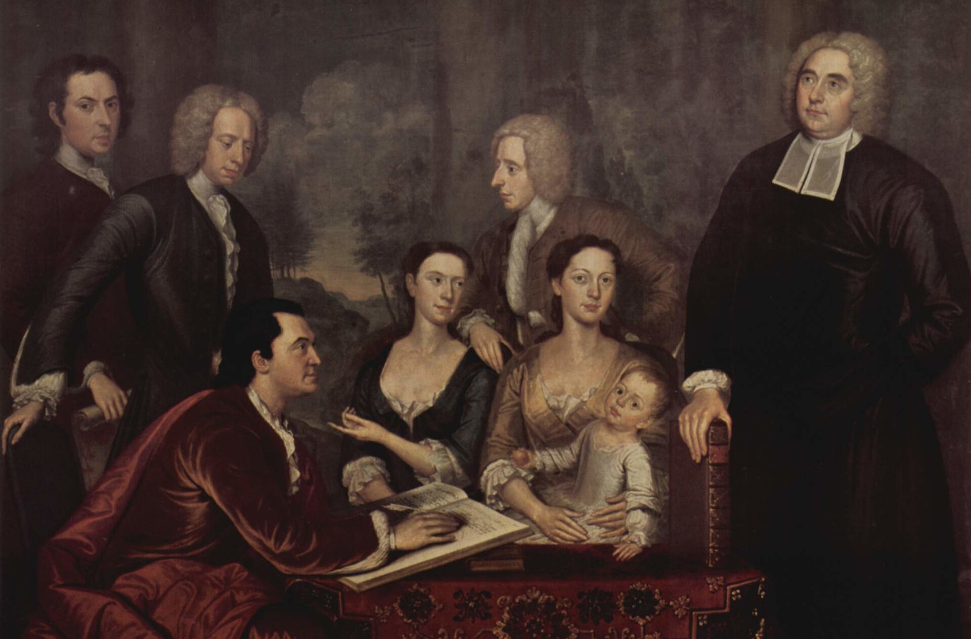 Obraz przedstawia portret grupy arystokratów. Są tu dwie siedzące, młode kobiety. Jedna z nich na kolanach trzyma kilkuletnie dziecko. Kobiety otacza pięciu mężczyzn. Czterech z nich stoi, piąty siedzi, pisze coś w dużej księdze.