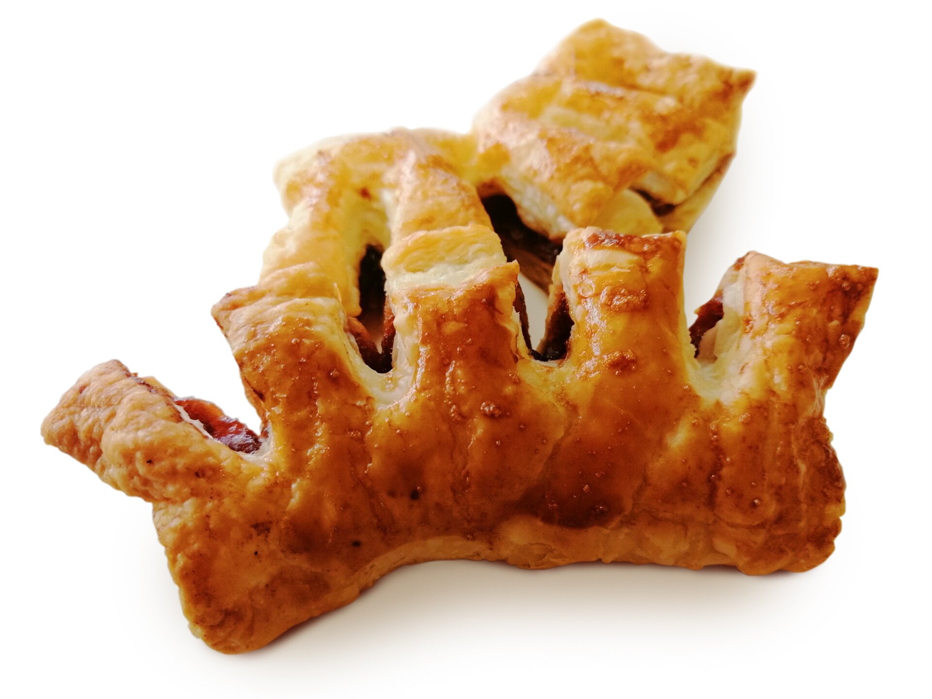 Ciastko koloru złocistego, wyglądające jak grzebień. W środku widoczne nadzienie.