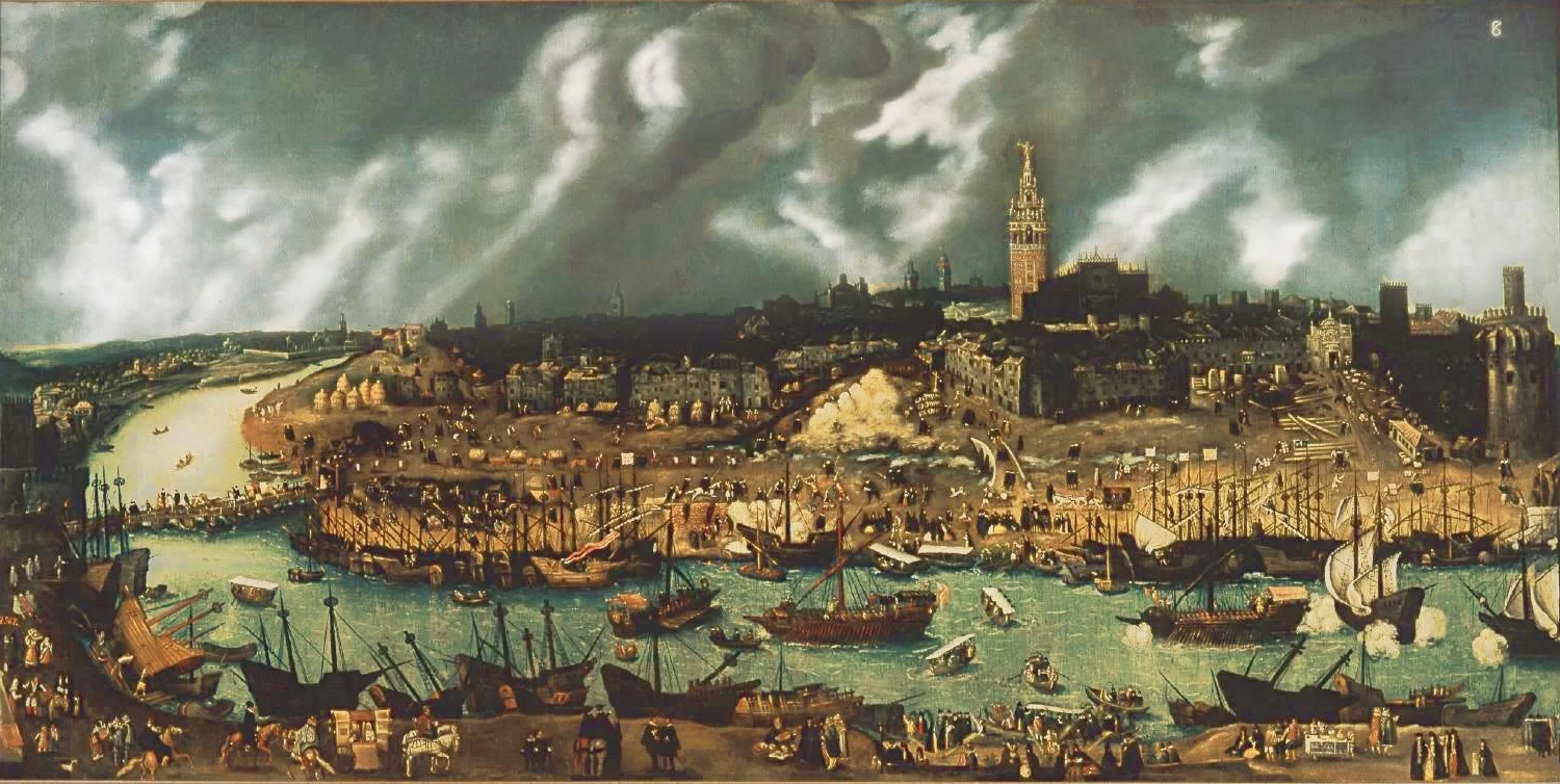 Ilustracja przedstawia panoramę miasta znajdującego się nad brzegiem rzeki. W dolnej części ilustracji rzeka, po której płyną liczne statki z białymi żaglami. Po obu stronach rzeki zacumowane statki. W dolnej części ilustracji piaskowy brzeg, po którym przechadzają się mieszkańcy oraz konie. Na drugim brzegu widoczna jest gęsto zabudowana panorama miasta, nad którą góruje wieża ratuszowa. Niebo nad miastem zasłonięte jest białymi chmurami. 