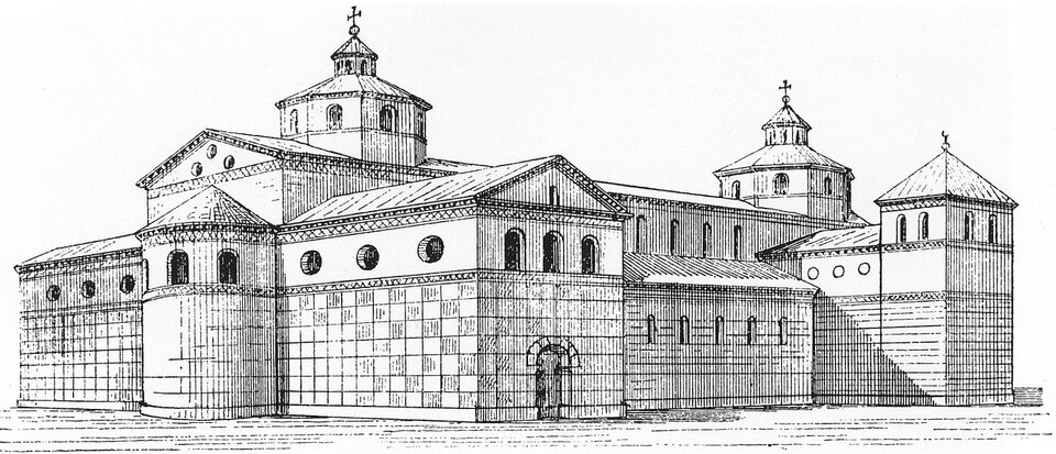 Czarno‑biały rysunek rekonstrukcyjny rozległego zespołu kościelnego w stylu wczesnośredniowiecznym. Budowla składa się z kilku połączonych brył z apsydami, prostokątnymi nawami i wieżami zwieńczonymi dachami namiotowymi oraz krzyżami. Elewacje są rytmicznie podzielone płaskimi zagłębieniami w murze i małymi, okrągłymi oraz półkolistymi oknami. Widok ukazuje całość pod lekkim kątem, podkreślając monumentalny i obronny charakter architektury.

