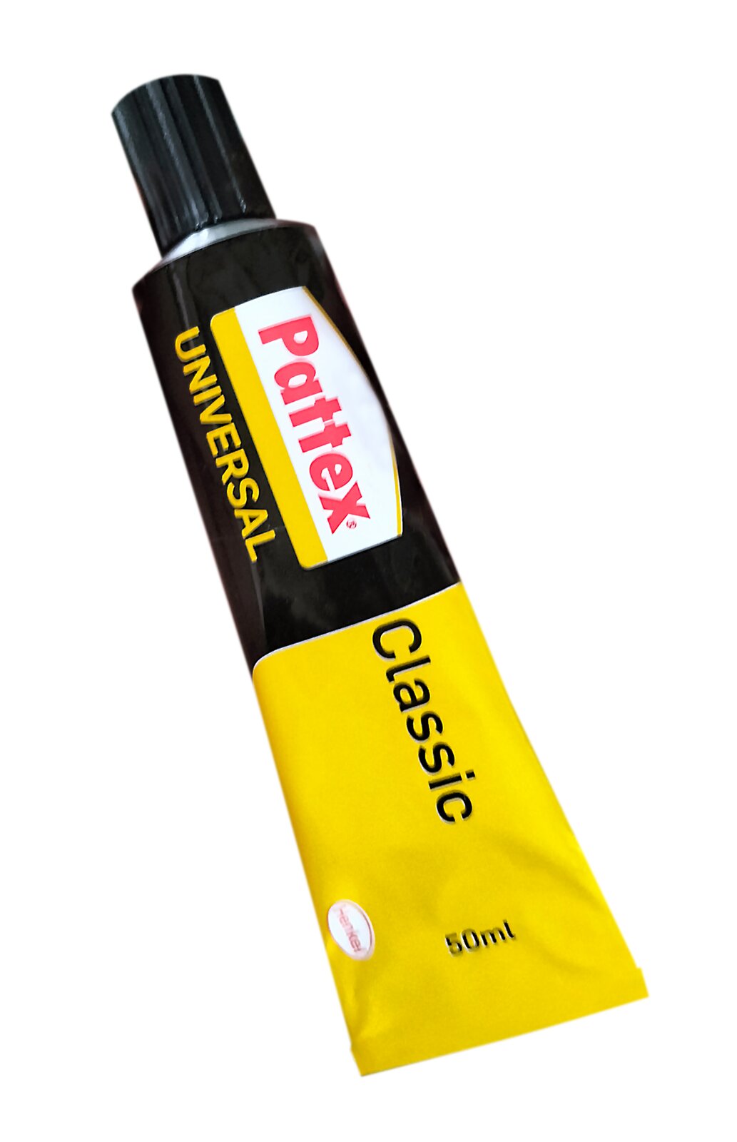 Zdjęcie przedstawia klej kontaktowy stosowany np. do łączenia galanterii włókienniczej z drewnem lub lakierowanym żeliwem. Widoczna jest czarno‑żółta tubka z czarną nakrętką. Na tubce widoczne są napisy Pattex Universal, Classic.