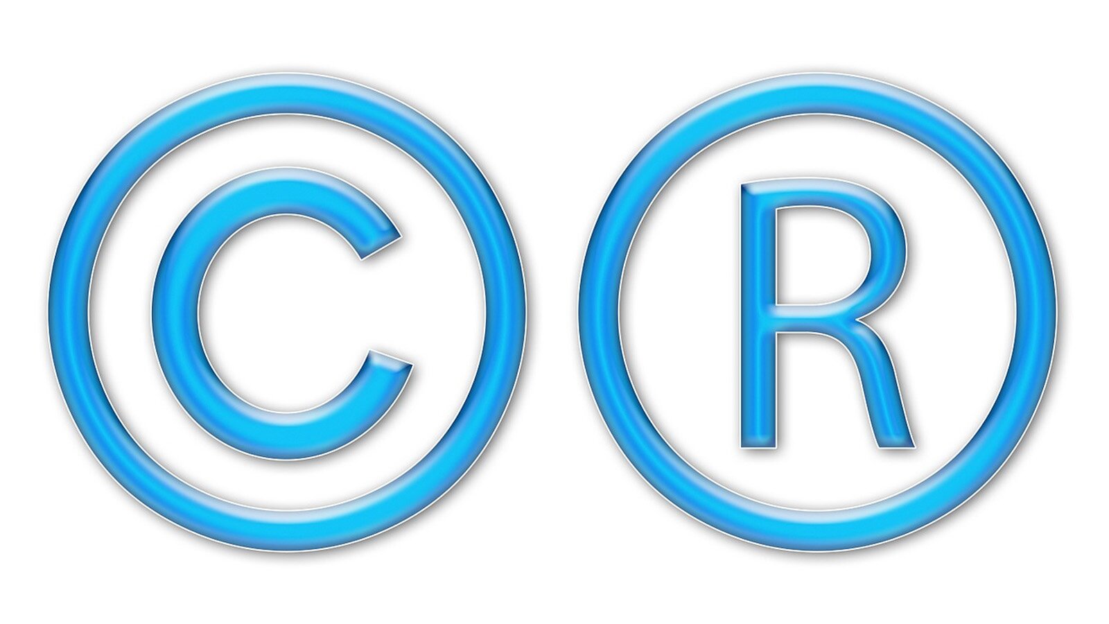 Grafika przedstawia dwa symbole używane do oznaczenia praw autorskich. Po lewej przedstawiono symbol składający się z wielkiej litery C otoczonej okręgiem, a po prawej literę R, również otoczoną okręgiem.