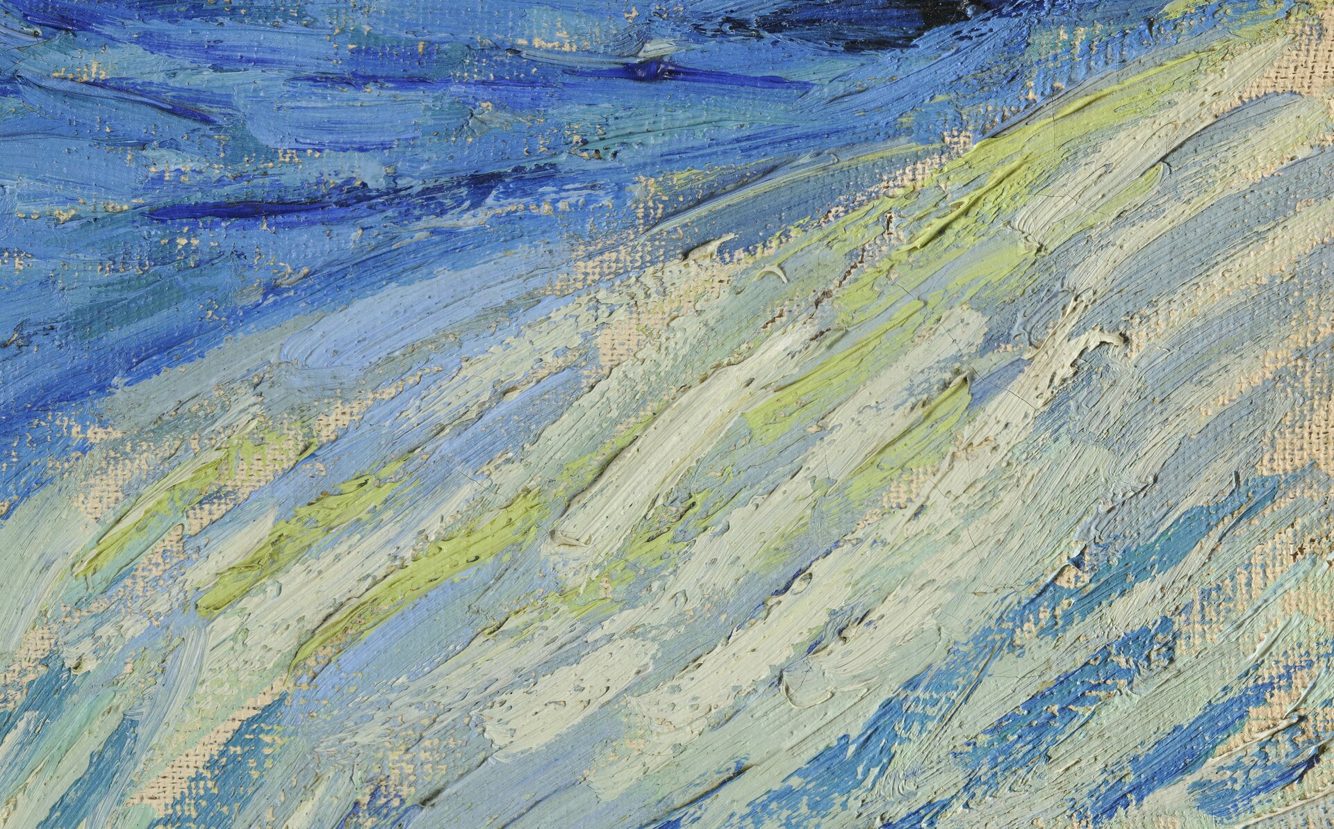 Detal obrazu autorstwa Vincenta van Gogha pod tytułem „Gwiaździsta noc” przedstawia fragment namalowany u góry niebieską farbą, przechodzącą w jaśniejsze odcienie. Zauważalne są długie, płynne pociągnięcia pędzlem, tworzące niełączące się ze sobą plamy koloru.