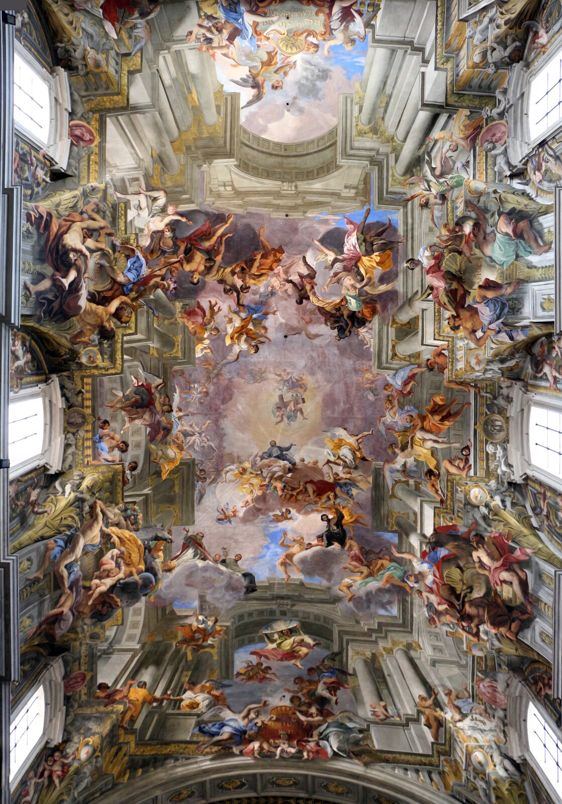 Ilustracja przedstawia dzieło Andrea del Pozzo „Alegoria misji jezuickich i triumf św. Ignacego”. Praca ta jest freskiem i znajduje się na suficie kościoła. Fresk przedstawia świętych oraz anioły w przestworzach.