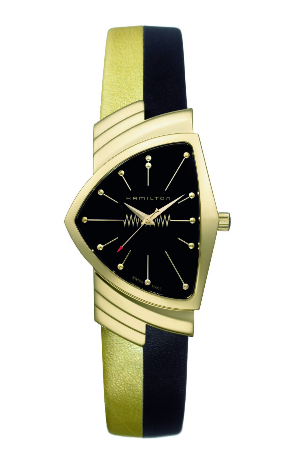 Zdjęcie przedstawia nowoczesny zegarek ze wskazówkami. Tarcza ma nieregularny kształt i jest koloru czarnego. Widnieje na niej napis „Hamilton”. Godziny zaznaczono kreskami. Wskazówki wyznaczają godzinę dziesiątą i osiem minut. Pasek zegarka jest w kolorze złoto‑czarnym.