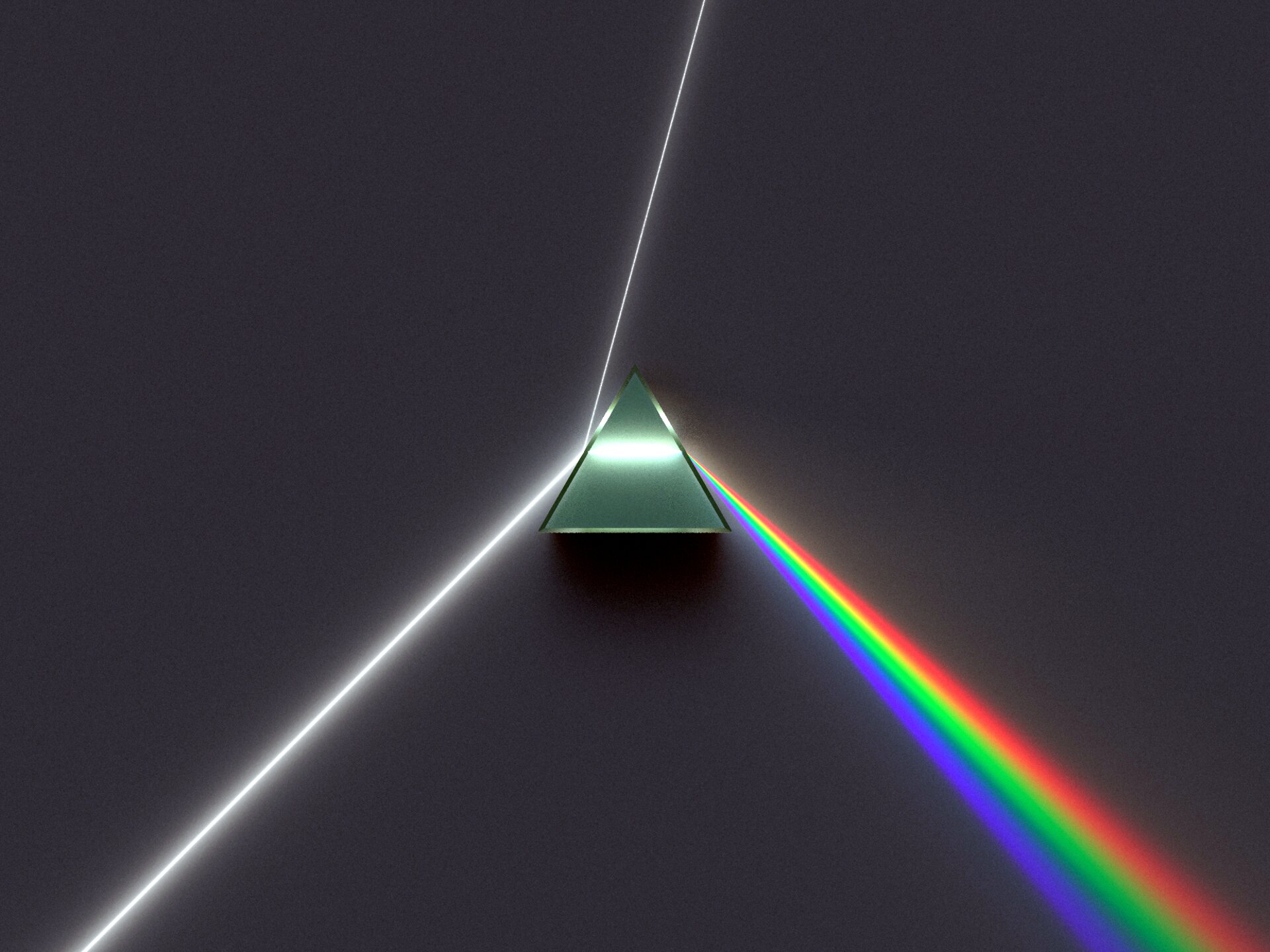 Zdjęcie pryzmatu trójkątnego i efektu rozszczepienia światła. Wiązka światła padająca na pryzmat częściowo odbija się, a częściowo przechodzi przez urządzenie (w środku widać biały promień, równoległy do podstawy), by z drugiej strony wyjść jako rozszczepiony, w postaci rozszerzającego się promienia o kolorach zmieniających się w poprzek niego (kolory tęczy - od najmocniej załamanego fioletowego, przez niebieski, zielony, żółty aż po najsłabiej załamanego, czerwonego).