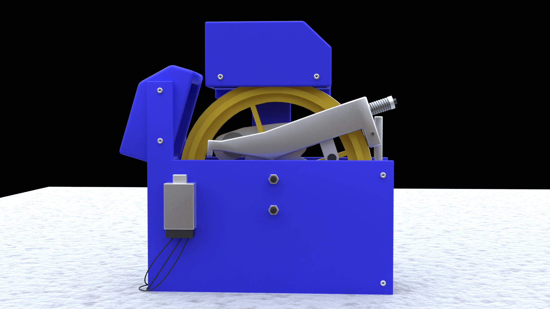 Grafika przedstawia urządzenie składające się z obudowy i koła posiadającego mechanizm blokujący jego obrót. Znajduje się nad szybem kabiny dźwigu.