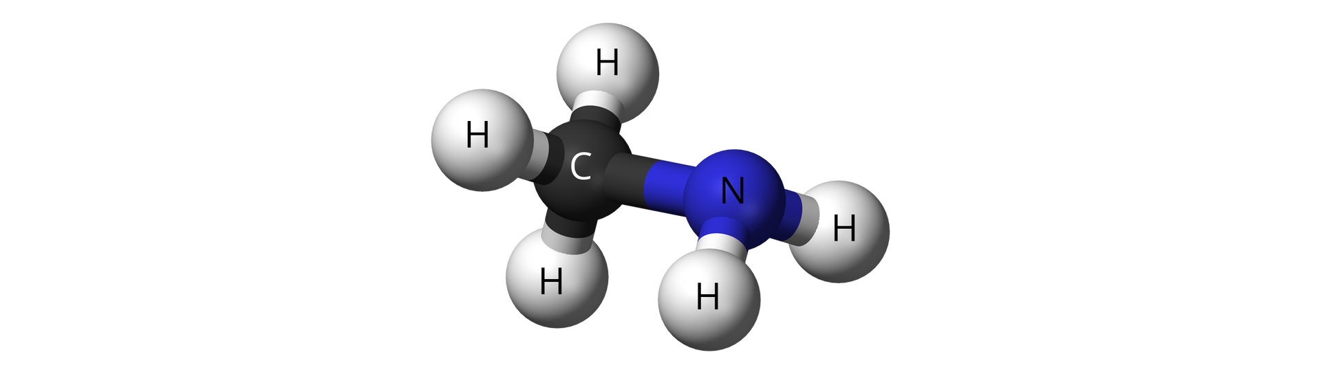 Na ilustracji znajduje się wzór kulkowy metyloaminy. Atomy wodoru przedstawiono w postaci szarych kulek, atom węgla jako czarną kulkę, atom azotu jako niebieską kulkę. Kulki połączone są grubymi kreskami. Atom azotu grupy aminowej wiąże się z atomem węgla grupy metylowej.