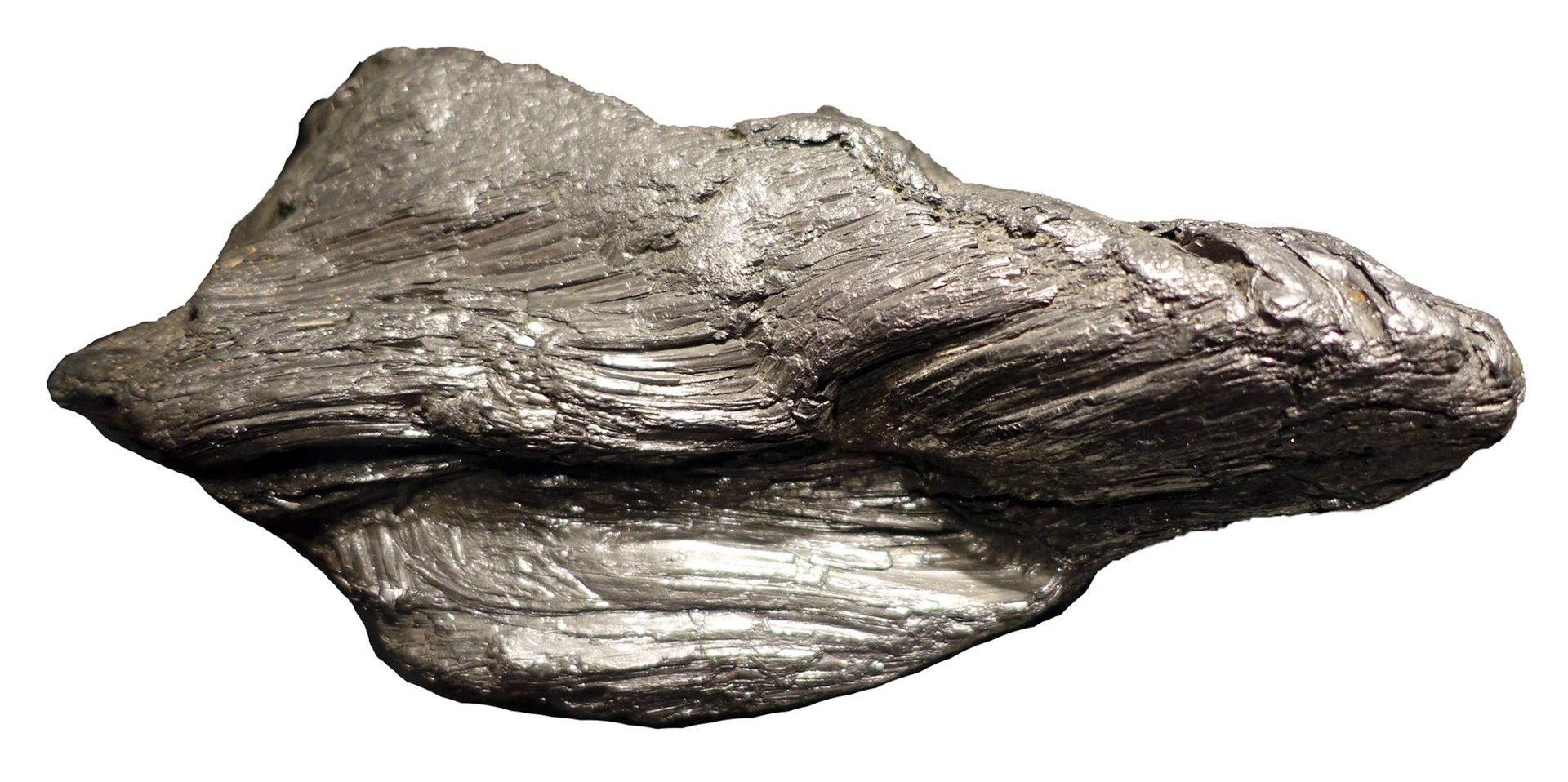 Na ilustracji ukazano kawałek ciemnoszarej, połyskującej skały o nieregularnej powierzchni.