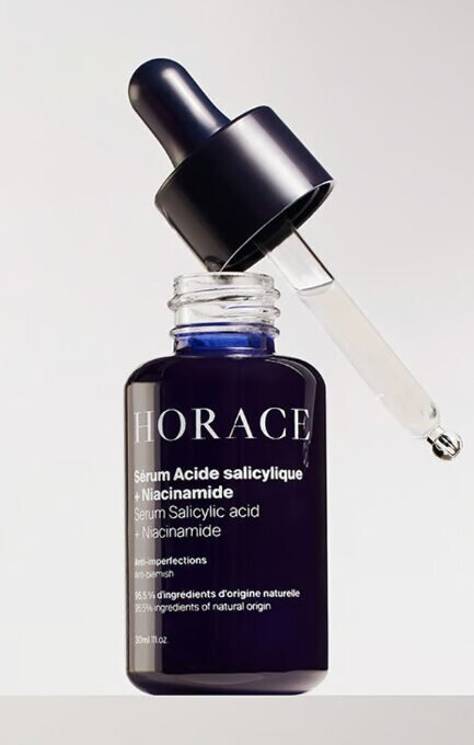 Zdjęcie przedstawia butelkę z pipetą, w których jest kwas salicylowy.