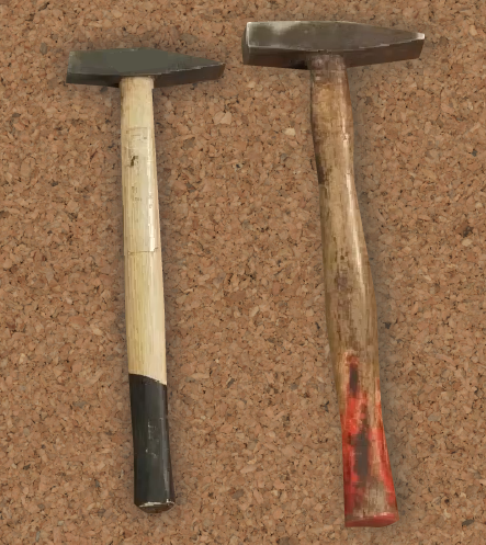 Zdjęcie przedstawia dwa młotki - większy i mniejszy. Młotki składają się z metalowych głów i drewnianych rękojeści. 
