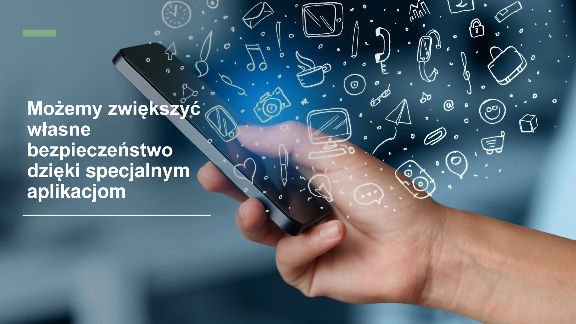 Slajd przedstawia zdjęcie dłoni, która trzyma telefon komórkowy. Na zdjęciu zostały narysowane białe ikonki: zegara, pędzla, strzałki, telefonu, aparatu, nuty, listu, płyty, komputera, serca, dymku, papierowego samolotu, długopisu, spinacza, kawy, zegarka, uśmiechu, sześcianu, kłódki, okularów, głośnika, wózka zakupowego. Z lewej strony slajdu, na zdjęciu, biały tekst: „Możemy zwiększyć własne bezpieczeństwo dzięki specjalnym aplikacjom”.