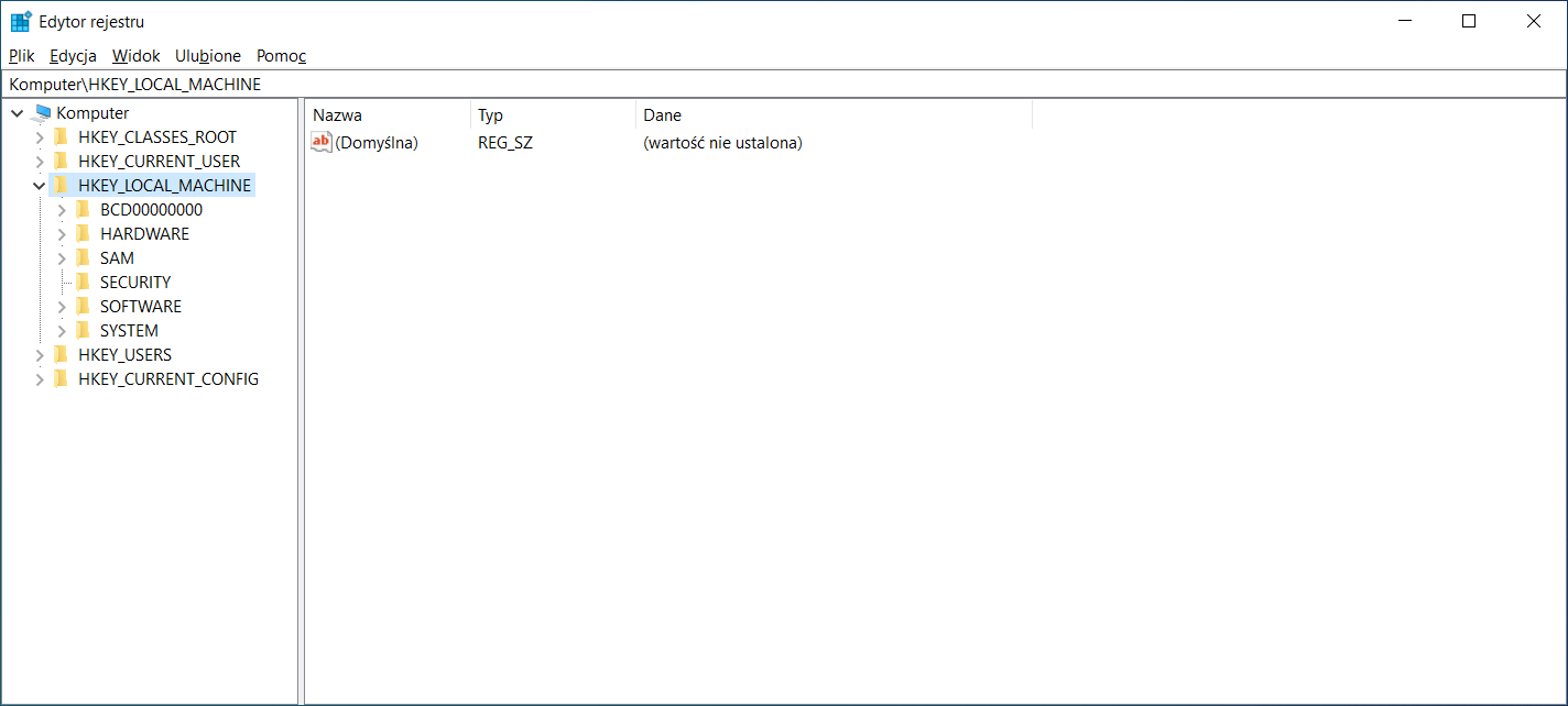 Ilustracja przedstawia okno Edytor rejestru systemu Windows. Po lewej stronie znajduje się menu nawigacji, natomiast po prawej stronie wypisywana jest zawartość. Okno ukazuje zawartość HKEY_LOCAL_MACHINE, znajduje się tam jeden element (Domyślna) typu REG_SZ bez ustalonej wartości.