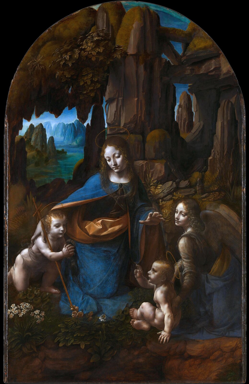 Ilustracja przedstawia obraz Leonardo da Vinci pt. „Madonna w grocie”. Ukazuje ona Maryję, anioła oraz małego Jezusa i świętego Jana. Znajdują się wewnątrz jaskini.