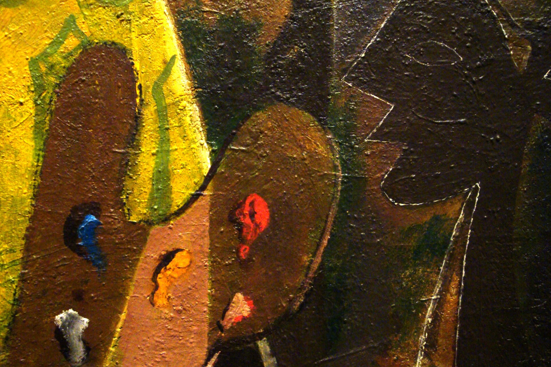 Obraz przedstawia paletę malarską z pięcioma, wyciśniętymi z tubki farbami: szarą, niebieską, żółtą, czerwoną i beżową. Z prawej strony profil człowieka namalowany ciemnobrązową farbą. Całość namalowano nakładając bardzo grubo farbę. 