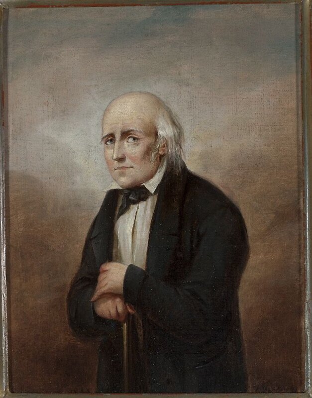 Obraz przedstawia dojrzałego mężczyznę. Postać ukazuje lewy profil. Twarz mężczyzny jest okrągła, pulchna, czoło wysokie, pomarszczone. Mężczyzna łysieje, ma ciemne brwi i głęboko osadzone oczy. Patrzy na nas. Jego nos jest spiczasty, policzki zarumienione, kości policzkowe wystające, a usta wąskie. Mężczyzna jest ubrany w koszulę i surdut. Na szyi ma zawiązany fontaź. Dłonie opiera o drewnianą laskę, którą trzyma przed sobą.