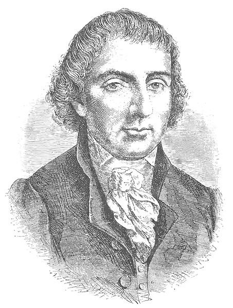 Ilustracja przedstawia portret mężczyzny w sile wieku. Postać jest ukazana od piersi w górę. Mężczyzna prezentuje prawy półprofil. Ma on owalną twarz. Jego brwi są ciemne, wyraziste. Oczy duże. Nos prosty. Usta duże, górna warga jest węższa od dolnej. Mężczyzna ma półdługie, lekko falujące włosy z krótką grzywką. Ubrany jest w koszulę i surdut. Na szyi ma przewiązaną apaszkę.