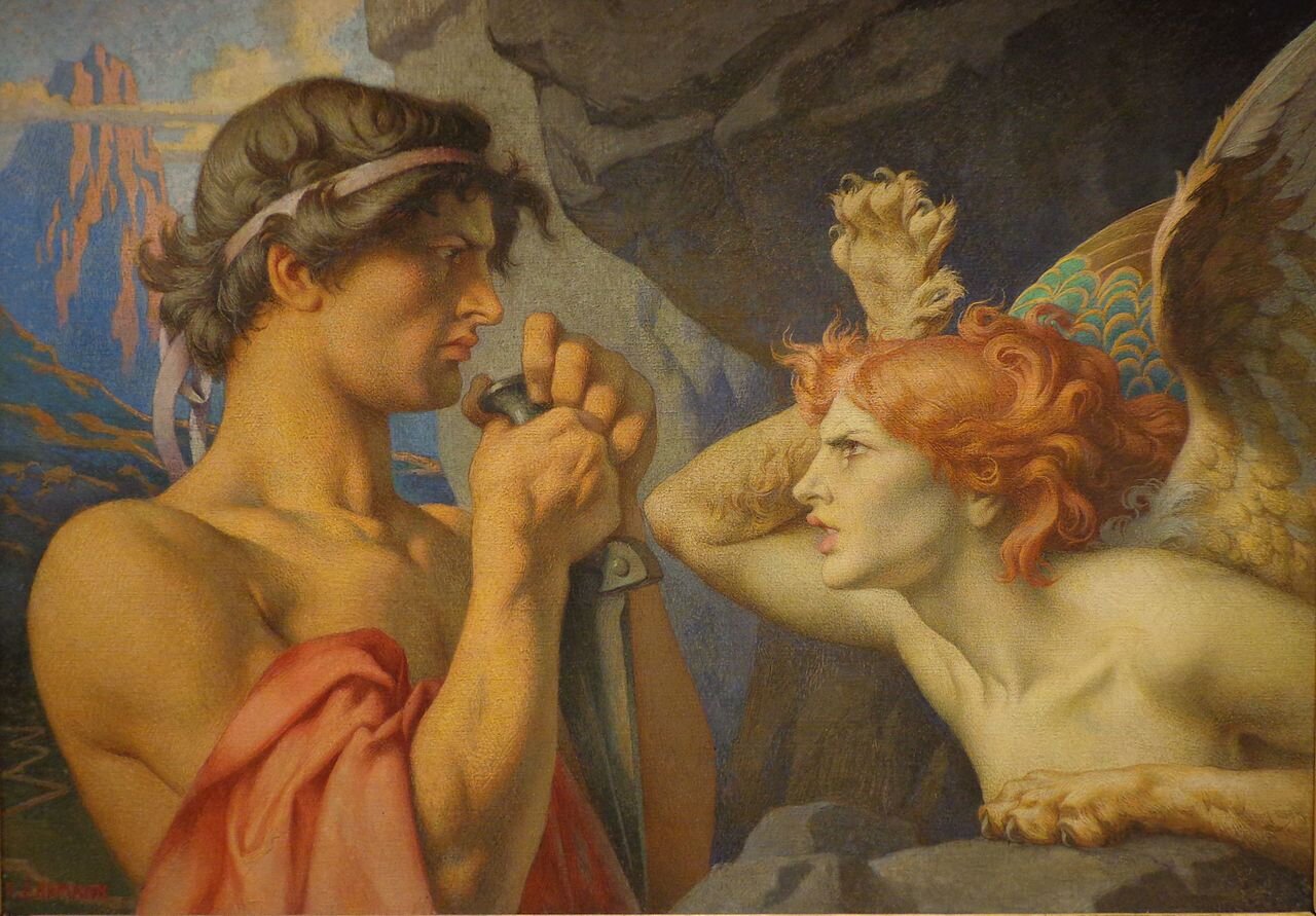 Obraz przedstawia młodego mężczyznę z krótkim mieczem w dłoniach, który stoi na przeciw Sfinksa. Sfinks ma twarz młodej kobiety o rudych, falujących włosach, a ciało skrzydlatego lwa.