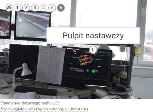 Zdjęcie przedstawia przykładowy wygląd ramki z opisem z atlasu interaktywnego. Po kliknięciu w punkt wyświetla się ramka z tekstem. Punkt ten podświetla się na szaro.