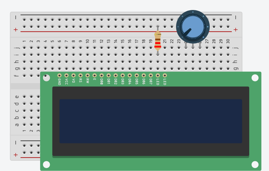 Wyświetlacz LCD 2×16, potencjometr oraz rezystor umieszczone na dużej płytce stykowej. Wyświetlacz znajduje się w dolnej części płytki, potencjometr w jej prawej górnej części, a obok niego wpięty jest rezystor ograniczający prąd podświetlenia ekranu.